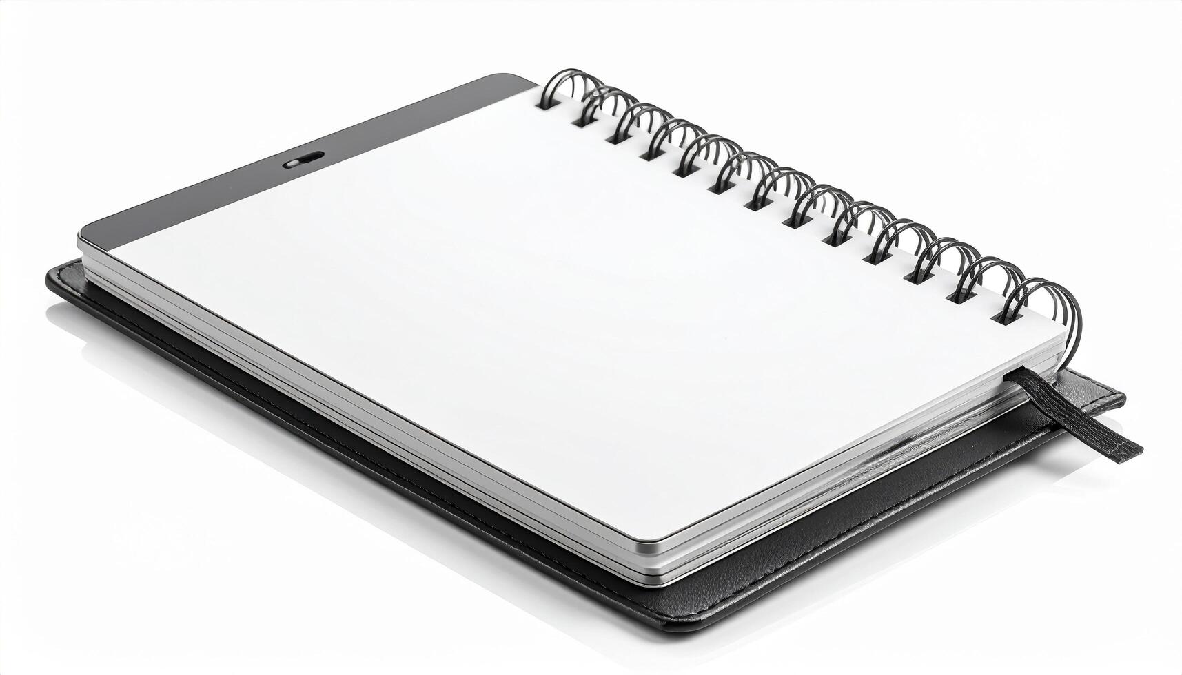 Sleek, modern notebook with spiral binding and leather cover, perfect for jotting down notes or sketches. Its clean, blank pages invite creativity and organization photo