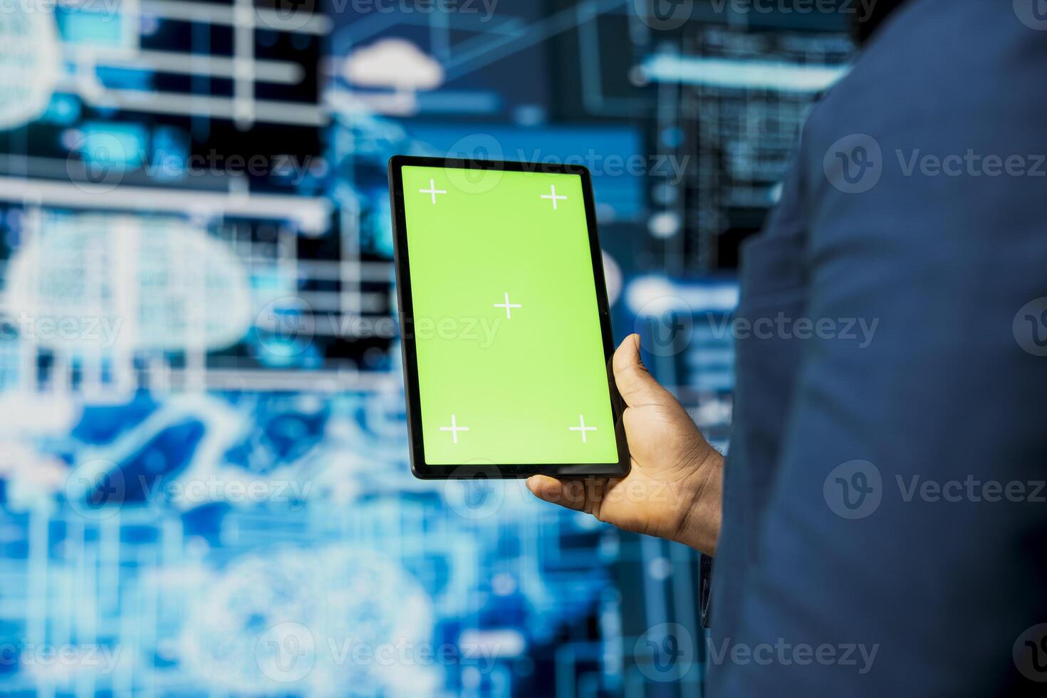 Black IT engineer analyzing algorithmic data next to copy space, uses devices surrounded by futuristic digital visuals. AI smart technology and neural networks in a high tech environment. photo