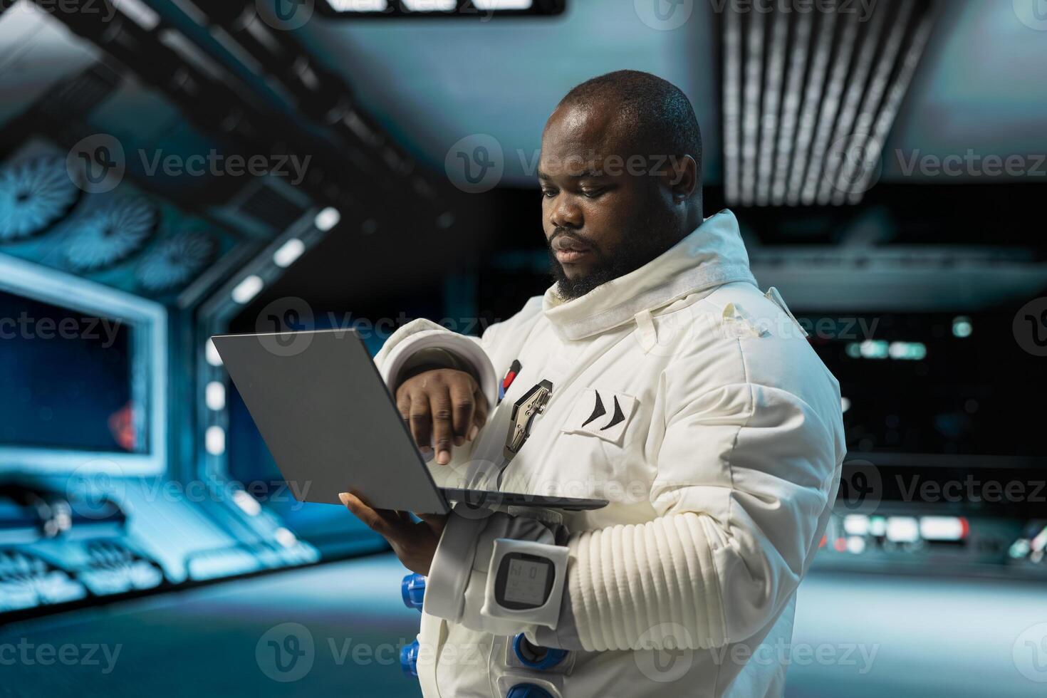 Orbit station crew member doing galaxy observation using laptop during scientific mission. Starship cosmonaut in spacesuit using notebook, monitoring system diagnostics during planetary exploration photo