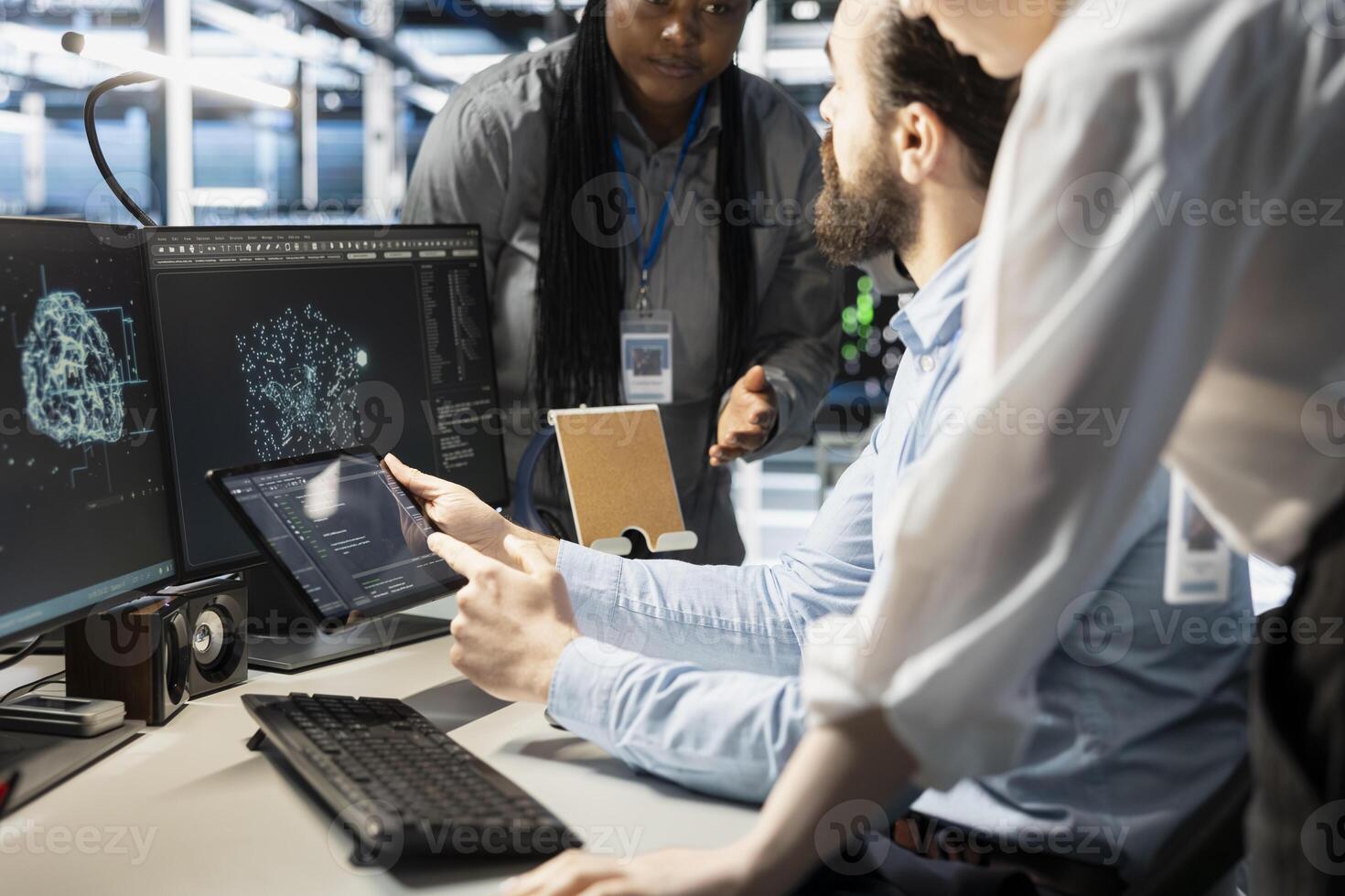 Engineering team doing brainstorming in data center, using AI powered tech to run simulations. Teamworking colleagues coding algorithms to extract insights from data and automate rigs photo
