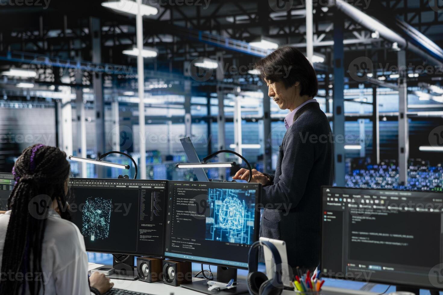 Data center developer monitoring AI systems, adjusting machine learning parameters. Server hub IT employee in office enhancing artificial intelligence software performance photo