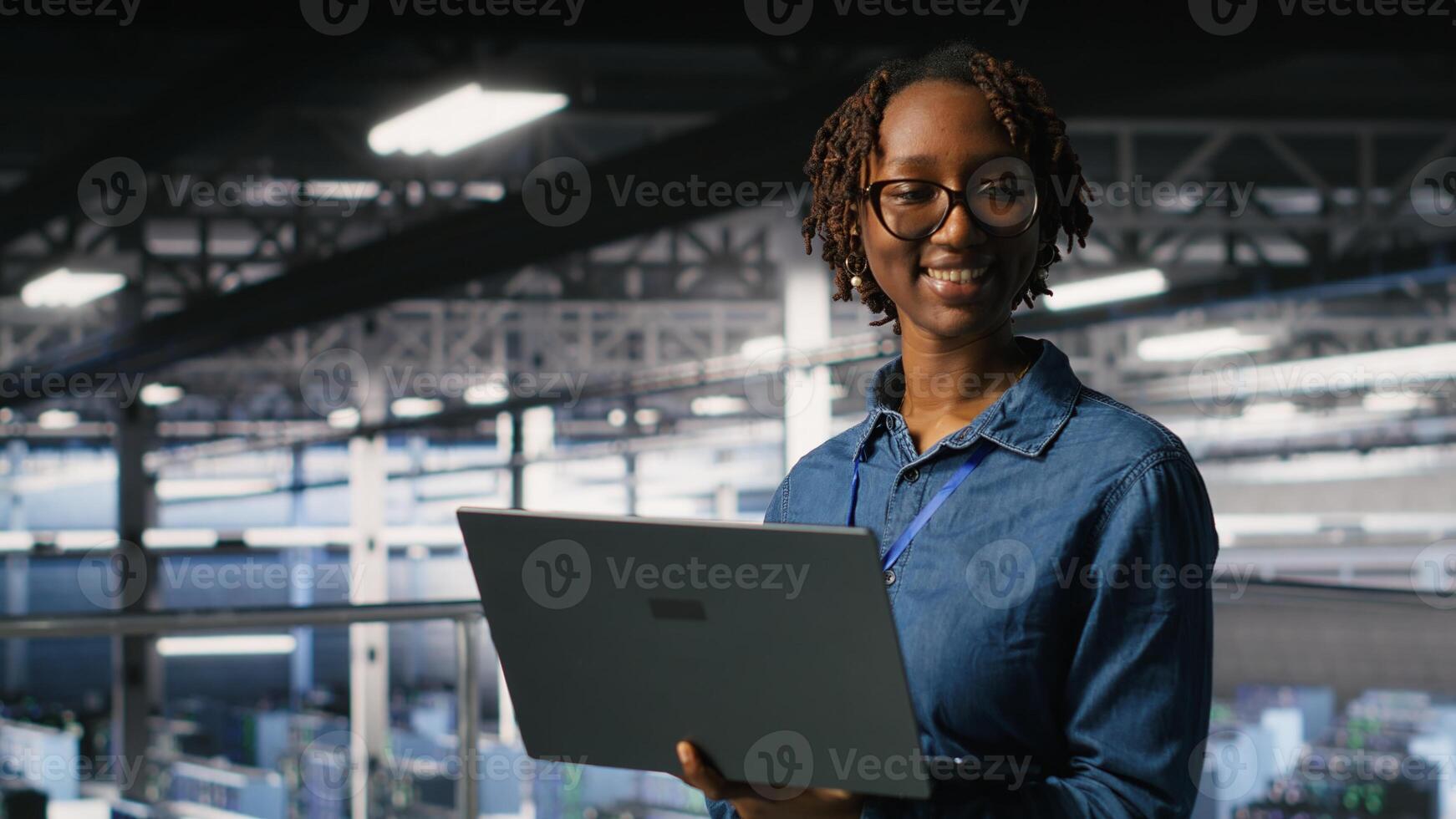 Portrait of joyful computer scientist in data center monitoring neural network LLM visualization. Upbeat woman in server farm overseeing rigs powering machine learning processes photo