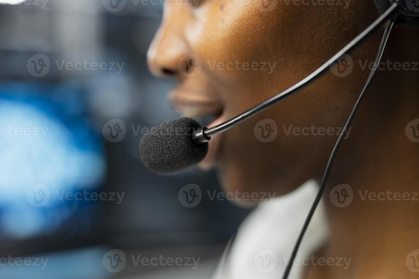 Extreme close up of headset microphone used by admin in data center to provide user technical support. Server hub worker talking in mic, assisting clients during remote call photo
