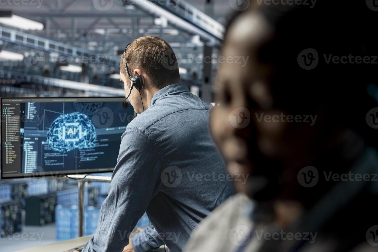 Data center expert assisting users with artificial intelligence enhanced troubleshooting, delivering technical support. Man in server farm chatting in headset mic with users in need of assistance photo