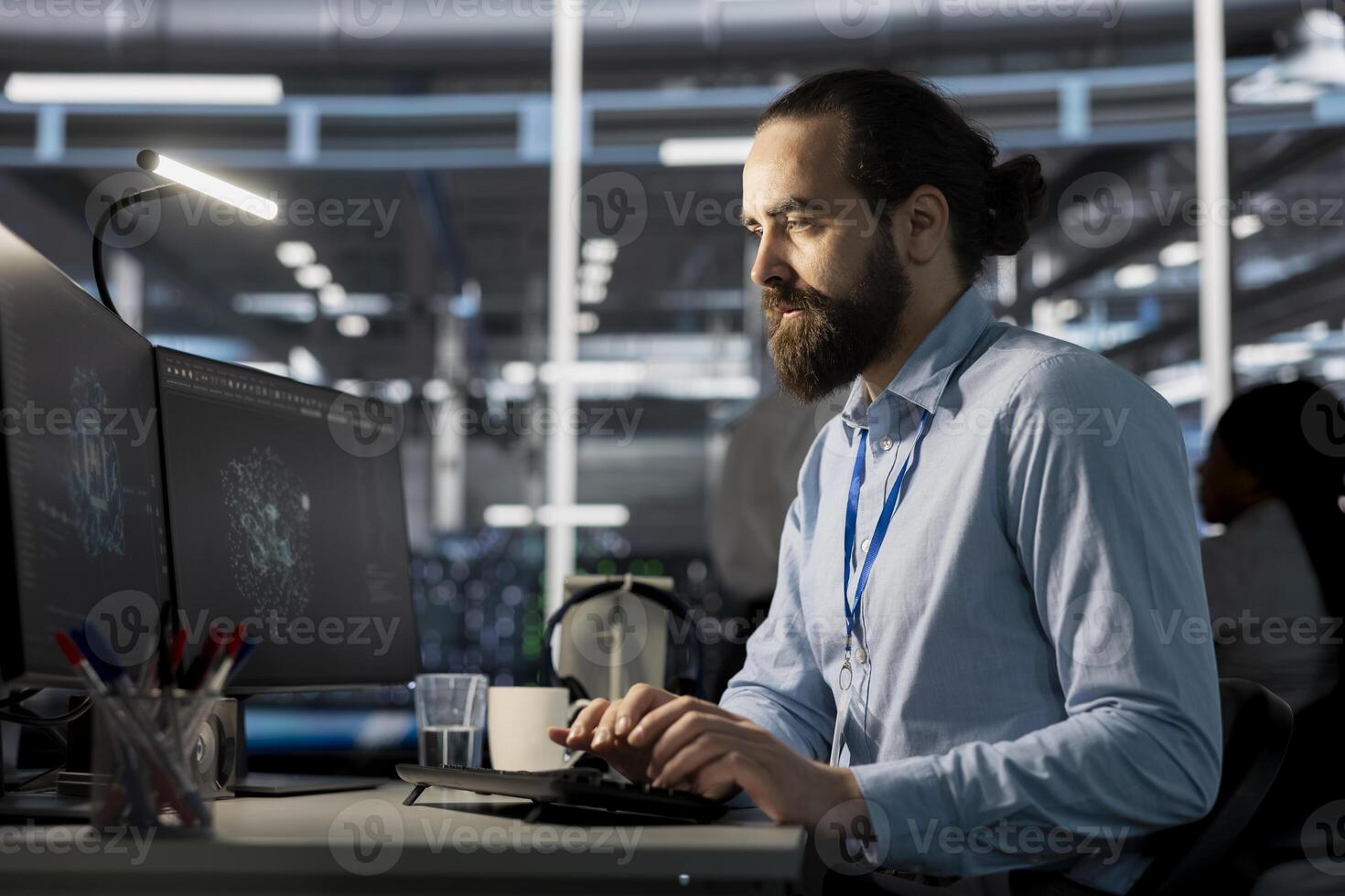 Software developer in data center using AI powered tech to run simulations. IT specialist coding cognitive computing algorithms to extract insights from data and automate infrastructure photo