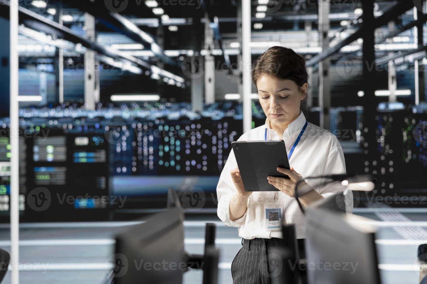 Engineer in data center using tablet, doing software updates, verifying neural network parameters. Technician in server room inspecting configurations, ensuring optimal application performance photo