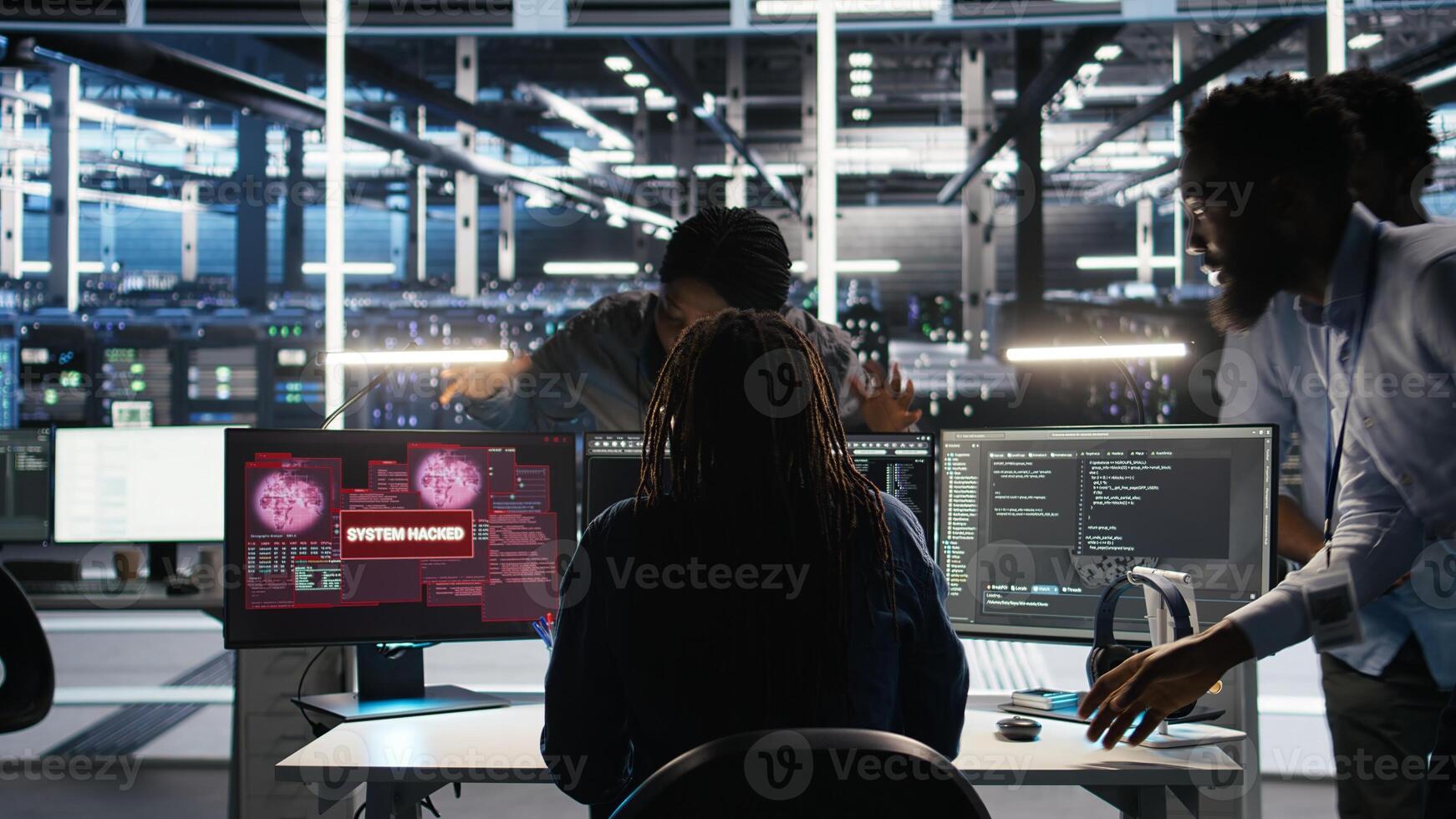 Cybersecurity team in data center responds to security breach, trying to prevent unauthorized access. Workers rushing to secure servers and protect sensitive information during cyberattack, camera A photo