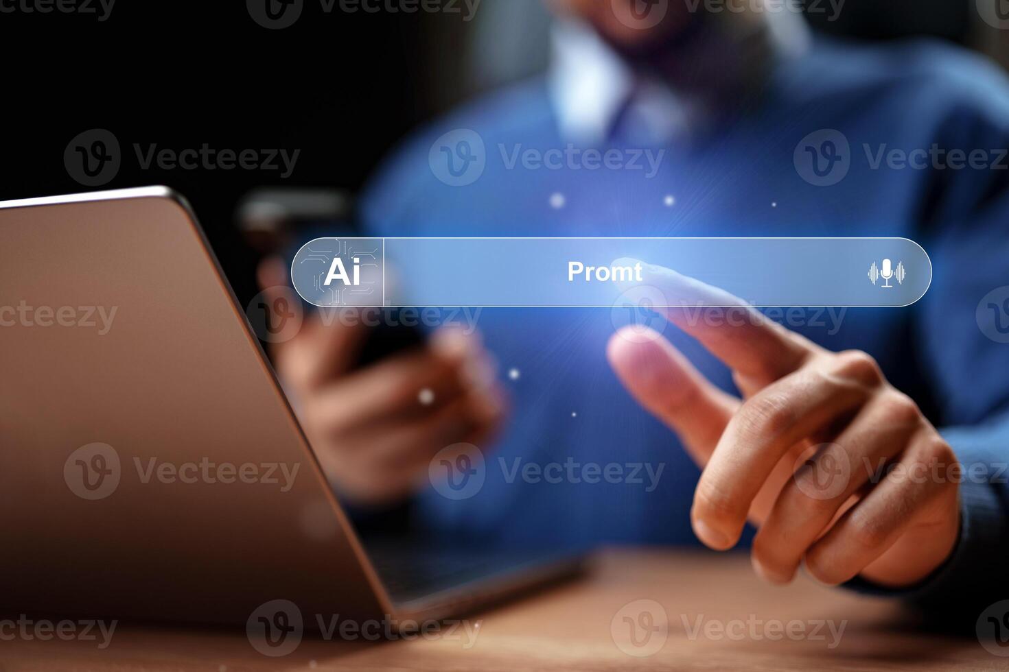 Person interacting with a laptop and smartphone while using artificial intelligence technology for prompt generation photo