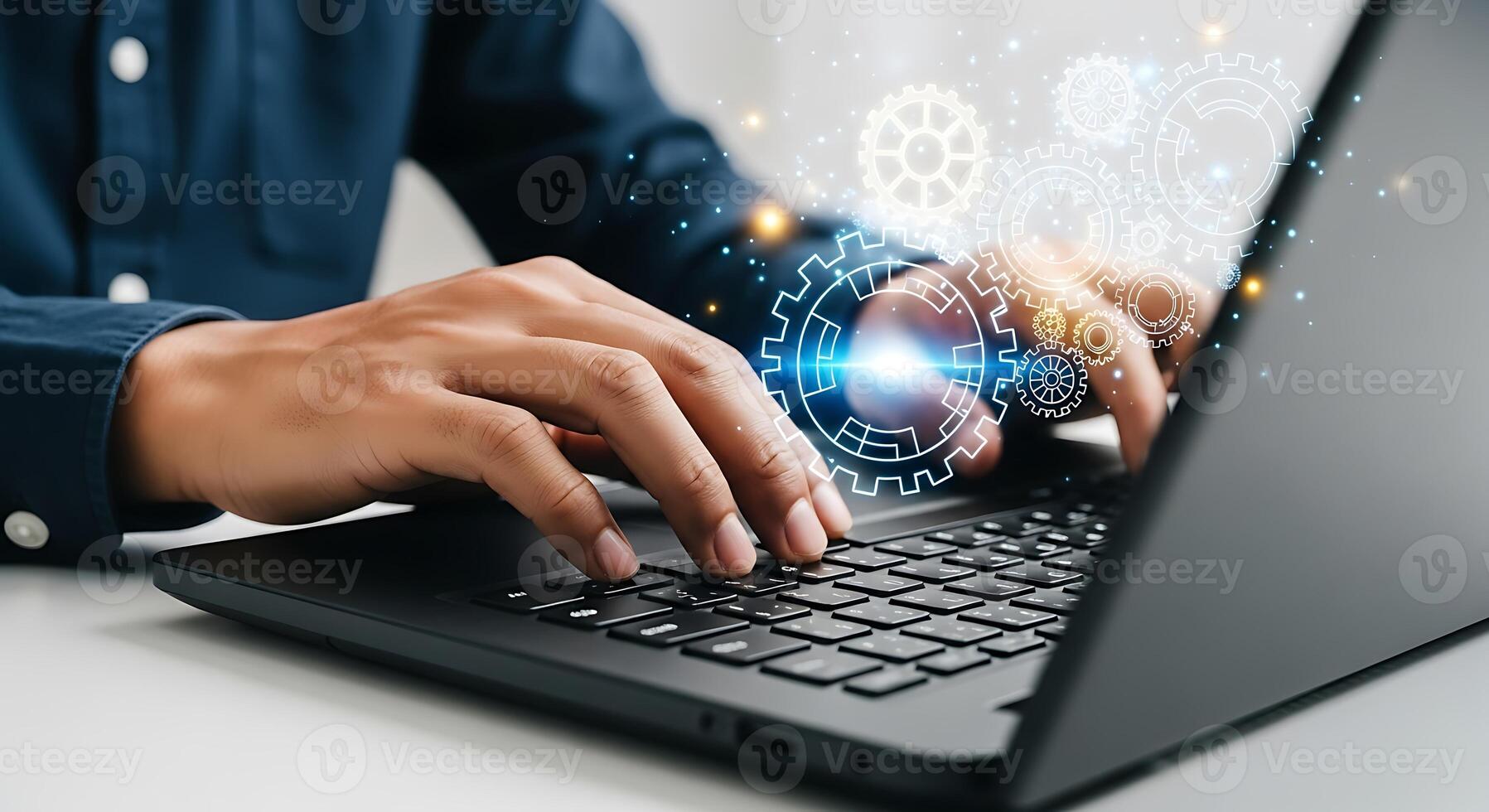 Close-up of hands typing on a laptop keyboard with futuristic digital data flow and glowing blue light effects symbolizing technology and innovation. photo