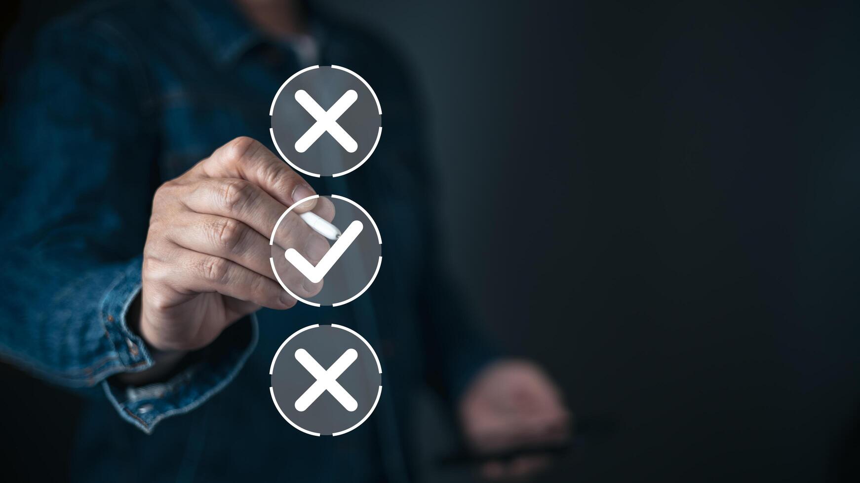 A person selects a glowing checkmark from a vertical list of choices displayed as icons with two crosses and one tick, symbolizing decision making, options, and choosing the correct path. photo