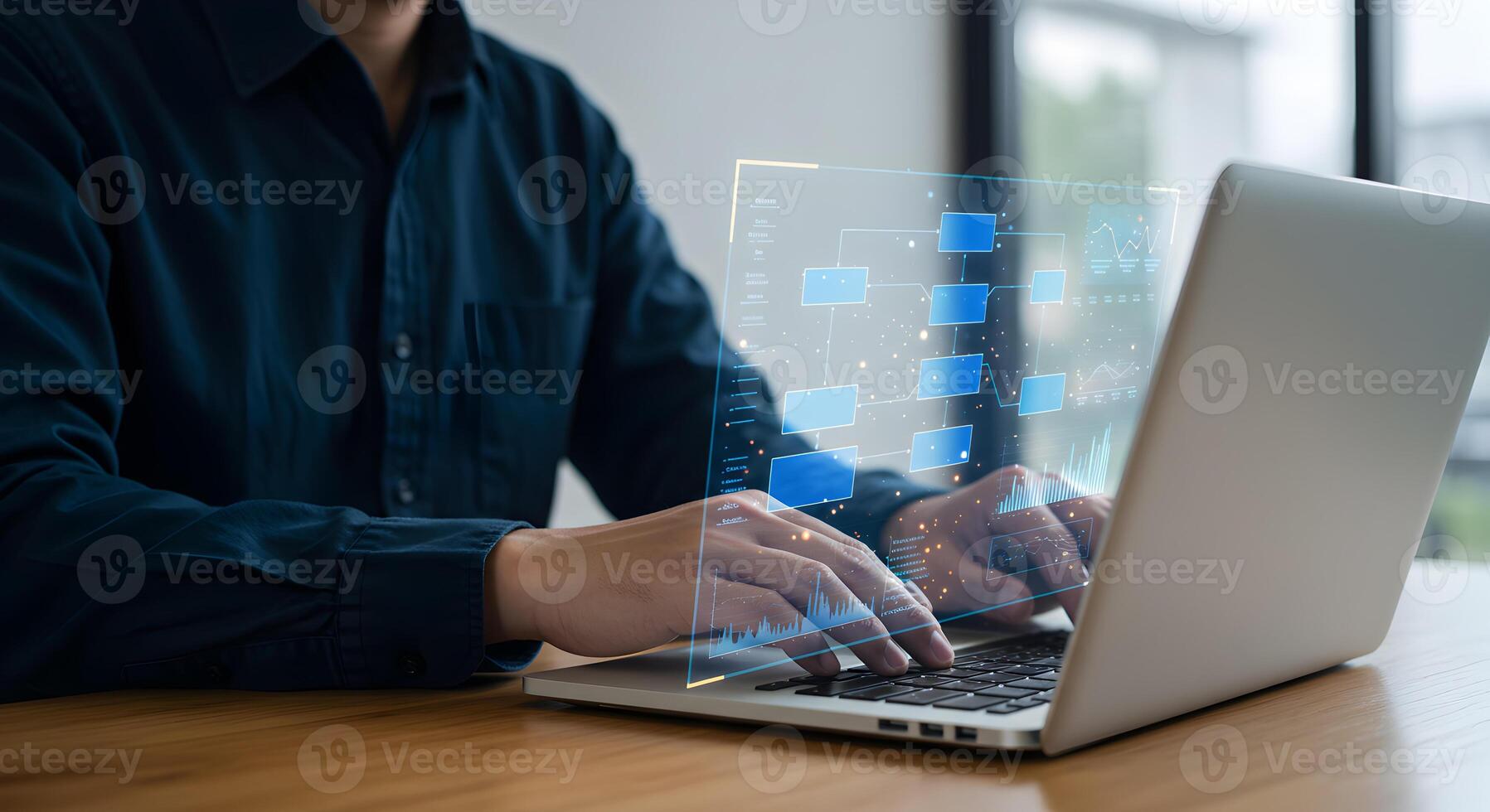 Man working on laptop with data flow diagram for business process automation and workflow optimization photo