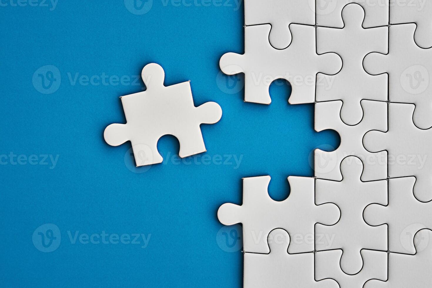 Puzzle piece missing concept jigsaw connection solution strategy teamwork challenge problem solving blue background photo