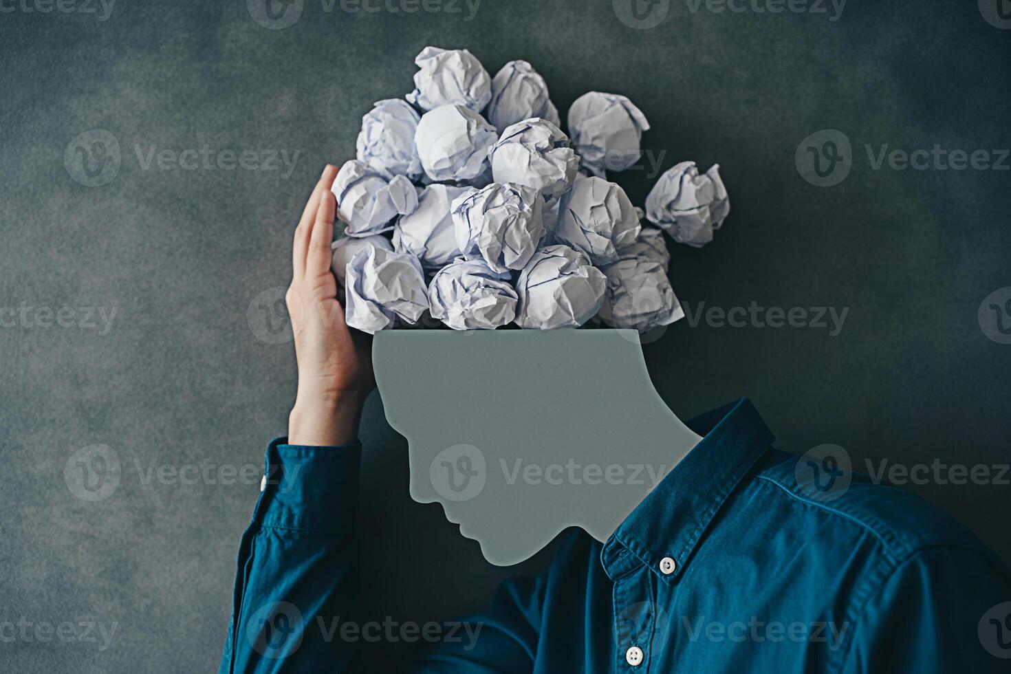 Concept of mental overload with crumpled paper head metaphor for stress and creative block brain fog 100 photo