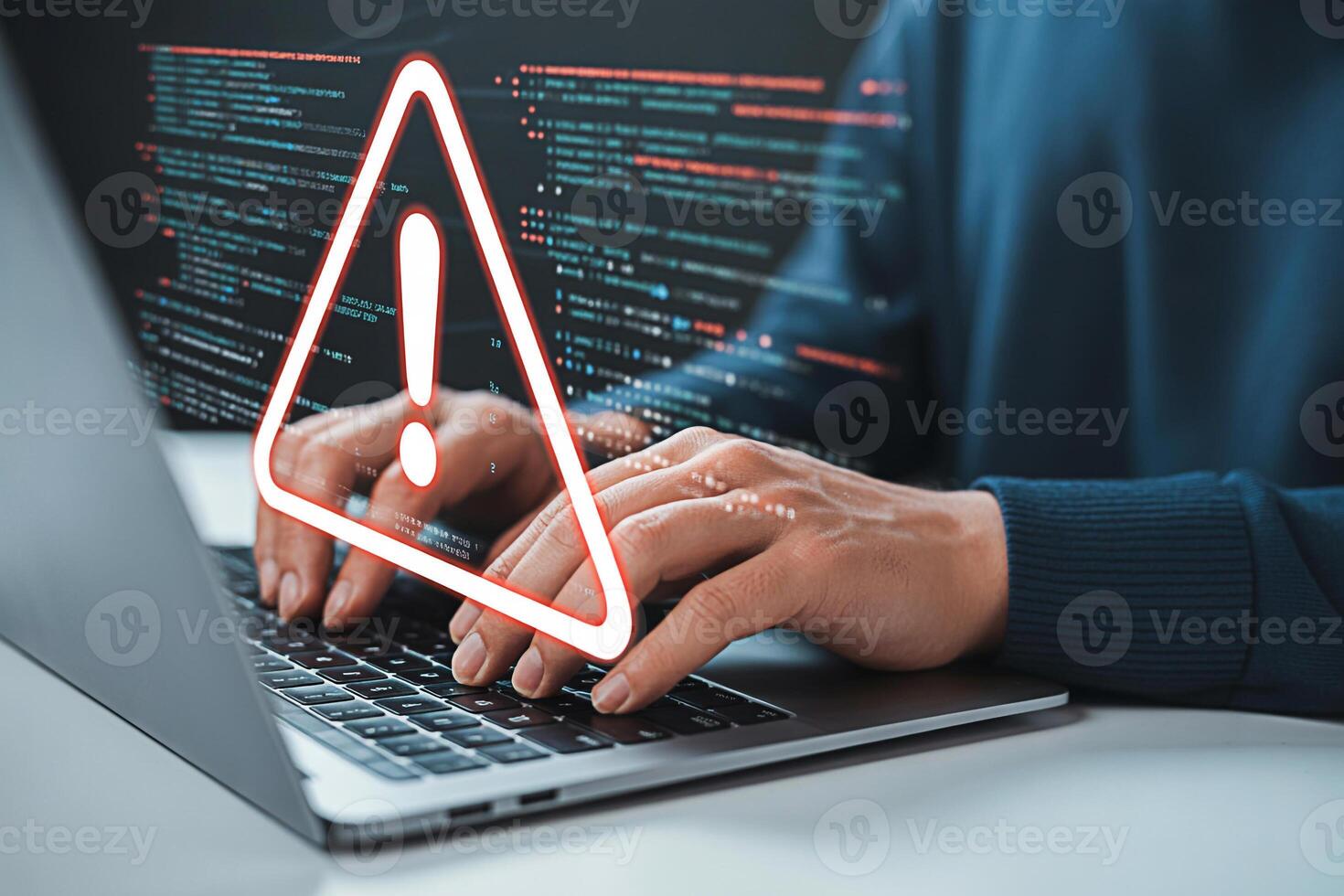 Cybersecurity threat detection alert on laptop computer screen with coding and hands typing keyboard photo