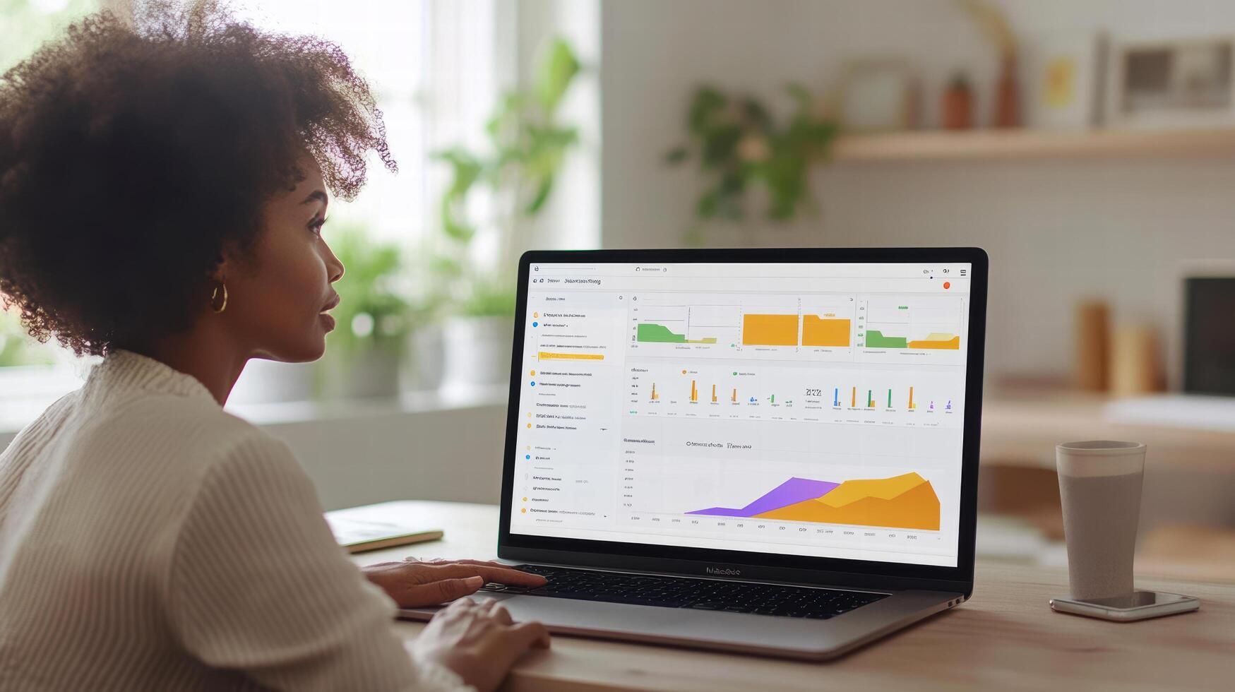 Data analysis on laptop screen with graphs and charts displayed photo