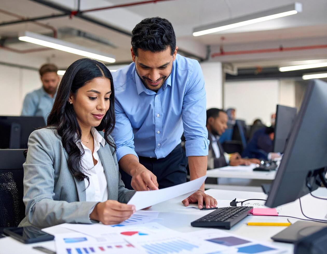 Professional team collaborates in modern office, sharing ideas and analyzing data with enthusiasm and focus photo