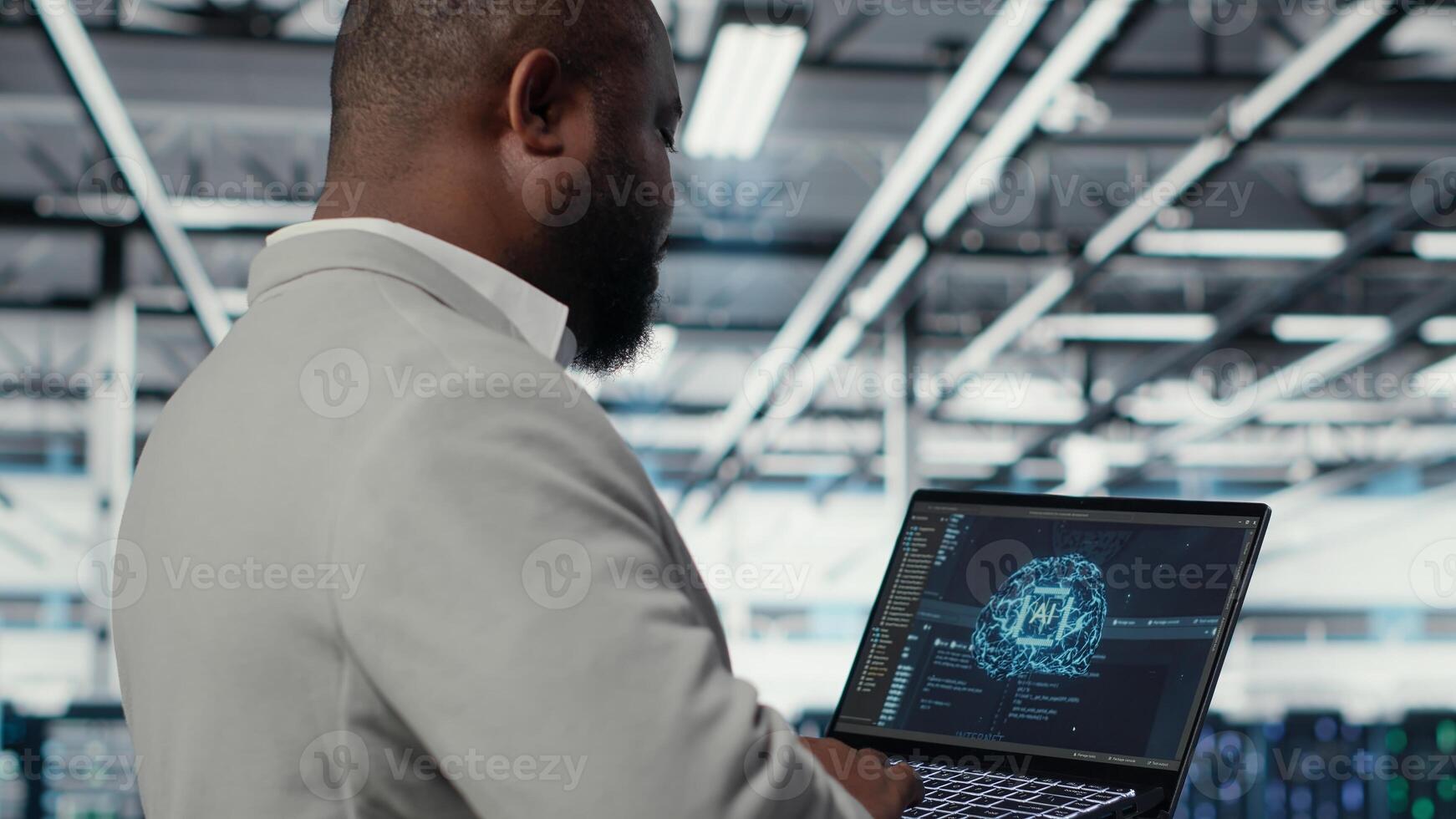 Data center admin doing IT maintenance tasks using AI technology. Server hub engineer providing tech support after identifying hardware issues using predictive artificial intelligence alerts, camera B photo