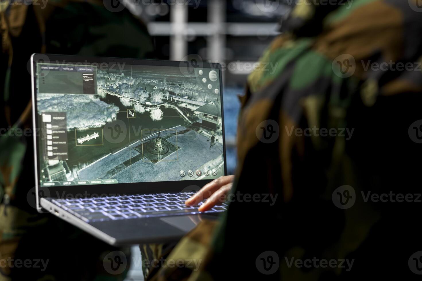Close up of military technician in data center operating satellite control software from secure terminal. IT specialist monitoring orbital surveillance feeds in military server room photo