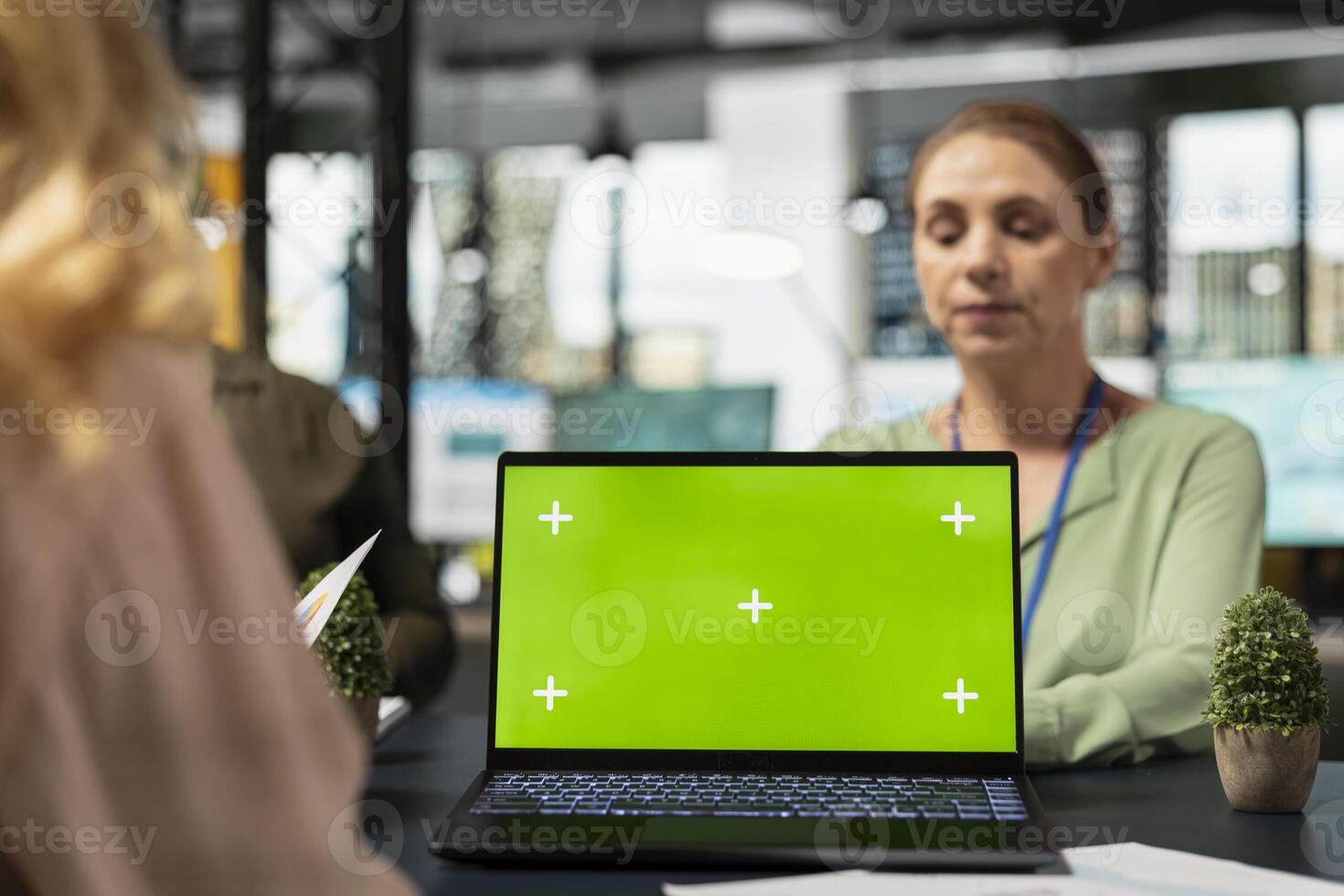 Team of ambitious shareholders collaborating with isolated copy space display in modern boardroom, strategic planning with data reports and infographics in a corporate work environment. photo