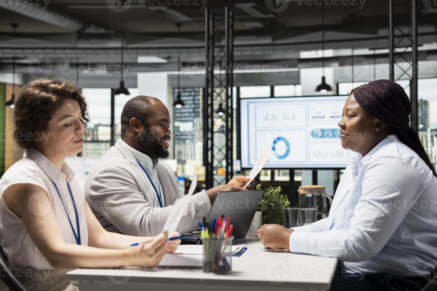 Candidate and the hiring team in a recruiting meeting discussing interview questions and the opportunity for onboarding into the department workforce. Experience evaluation, head hunting. photo