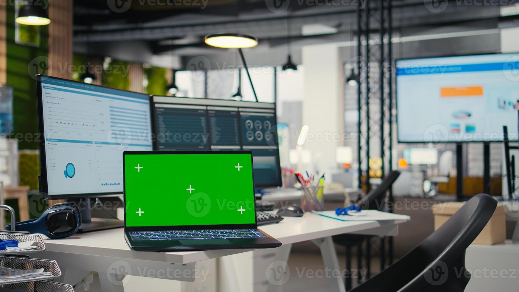 Empty office environment showcases modern tools of chroma key and resources essential for business planning, performance analysis and the development of insights for innovation. photo