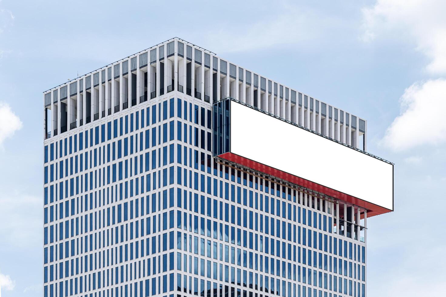 Mock up white horizontal large LED display billboard on building. Clipping path for mockup photo