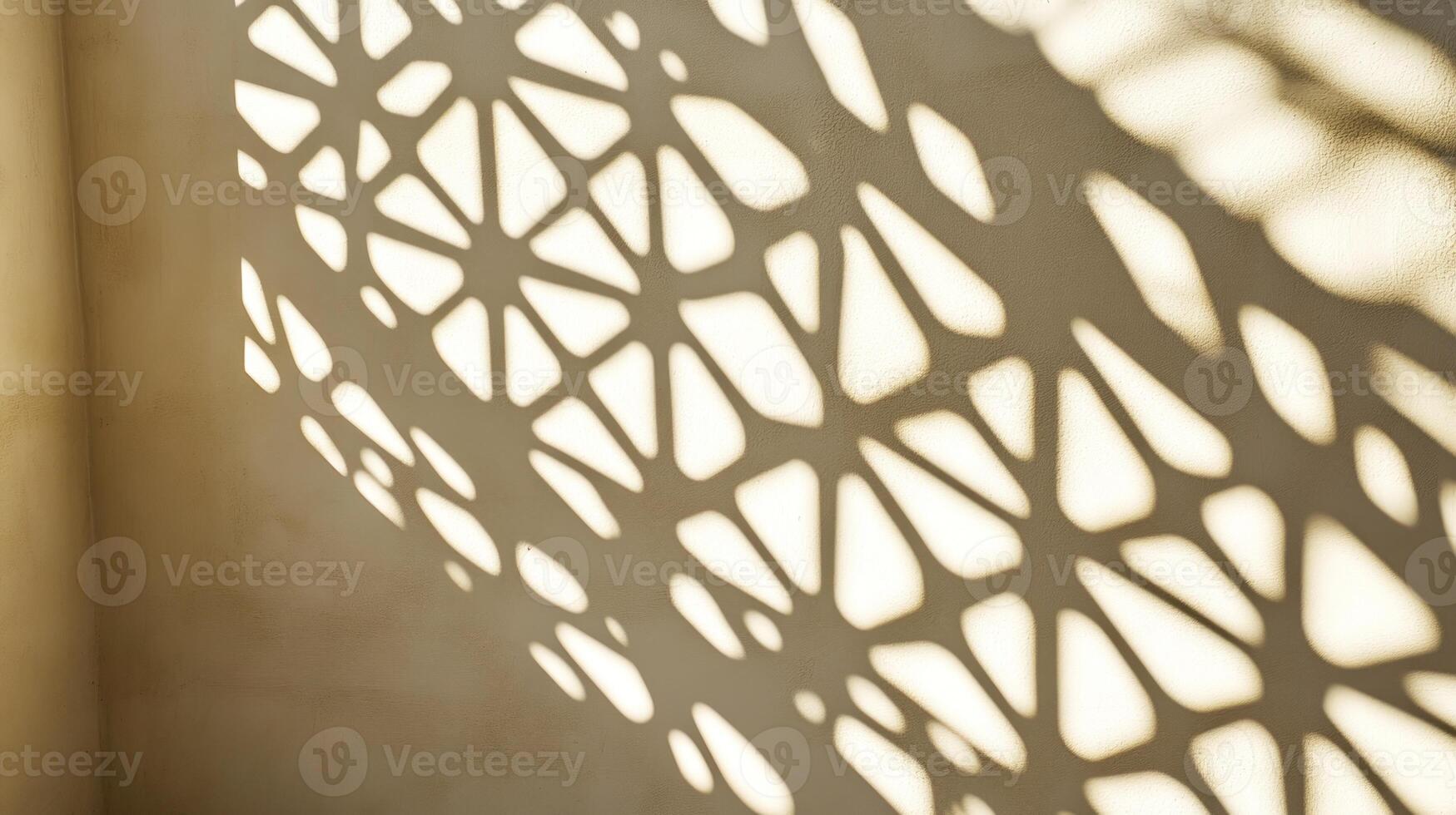 Abstract shadow pattern on a light beige wall photo