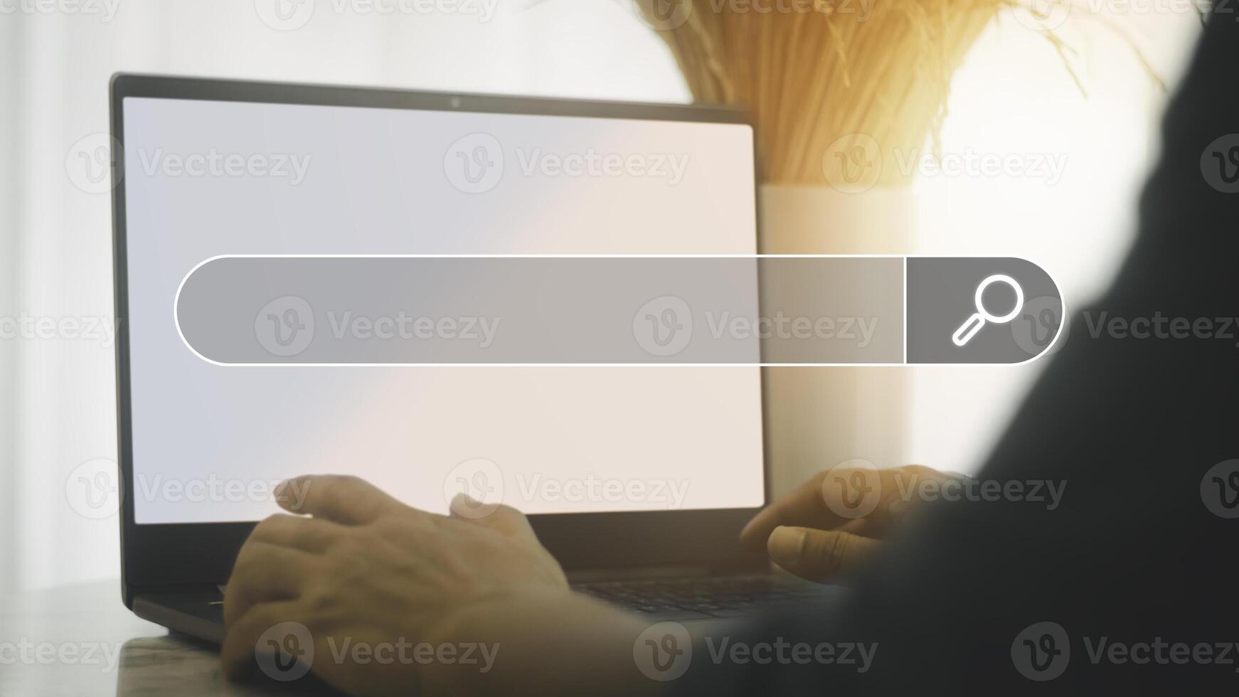 Man's hand are using a loptop to searching for information. Search Engine Optimization concept. photo