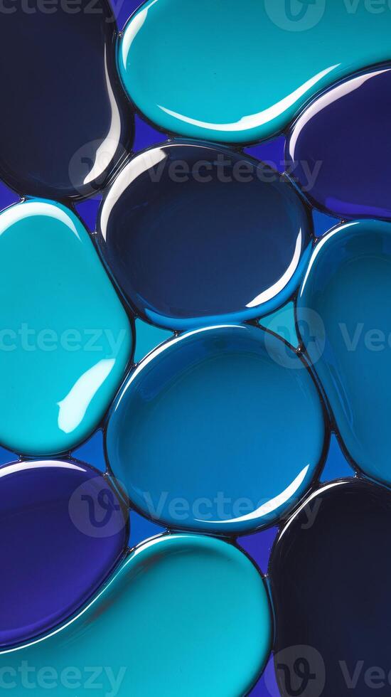 Colorful abstract display of blue and turquoise paint blobs on a contrasting background. photo