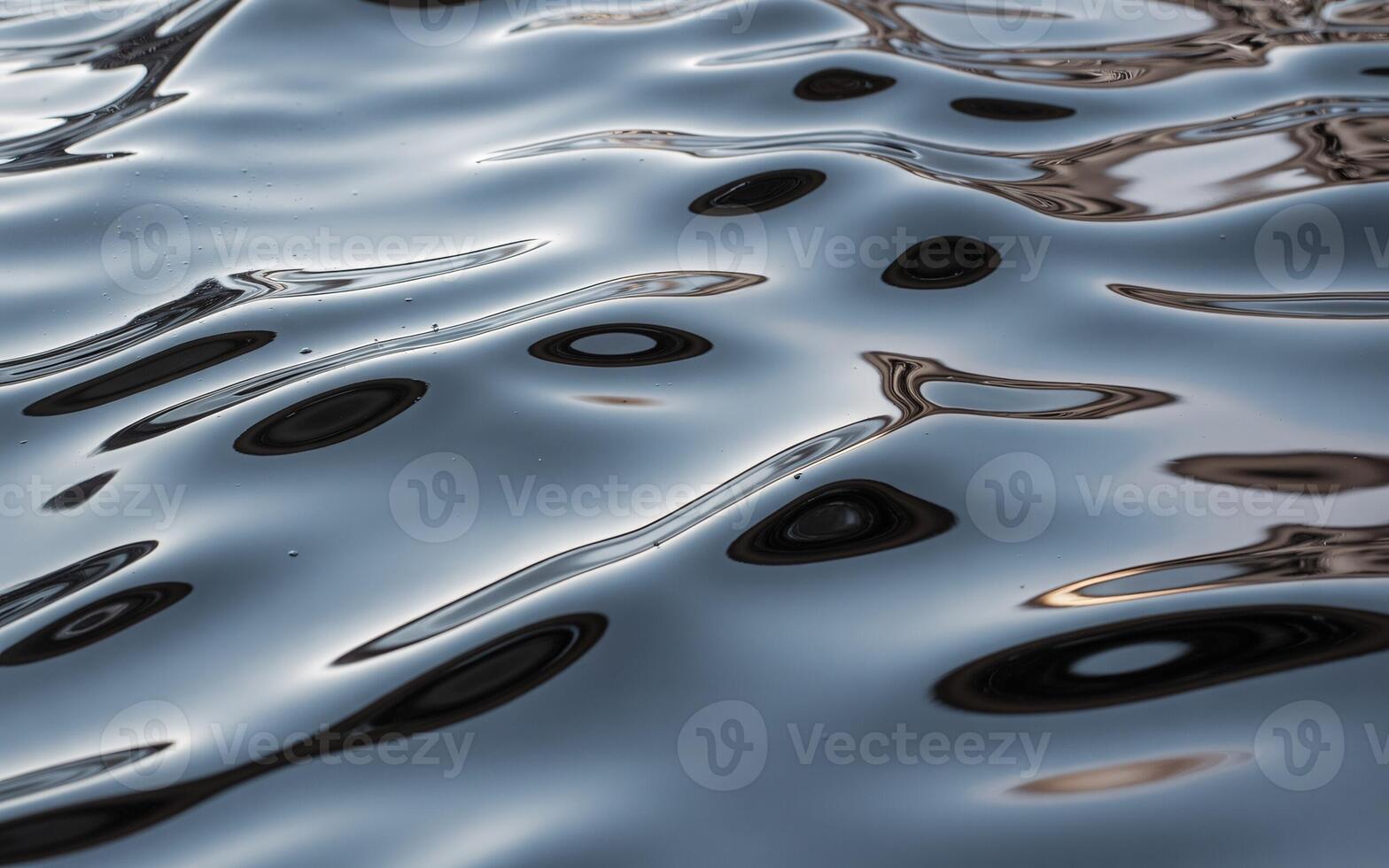 Calm water surface reflecting shadows and light, creating mesmerizing patterns of ripples and reflections. photo