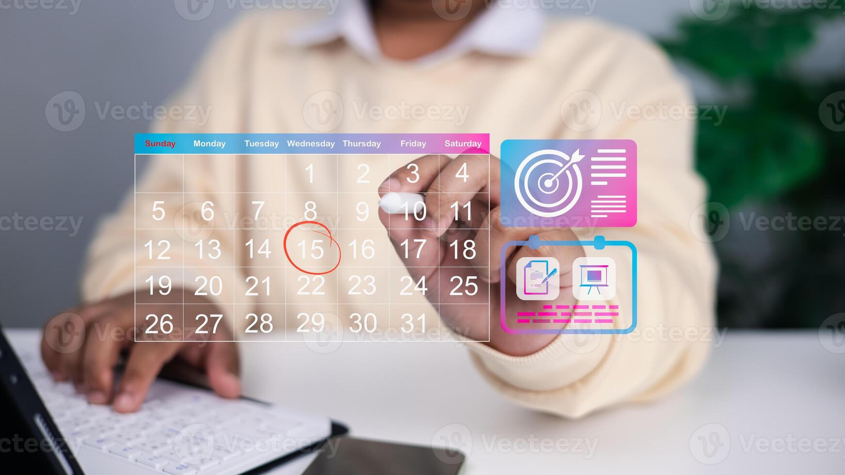 Close up of person using transparent digital calendar with highlighted date and floating icons for goals, task management, and project planning, concept of time management and productivity. photo