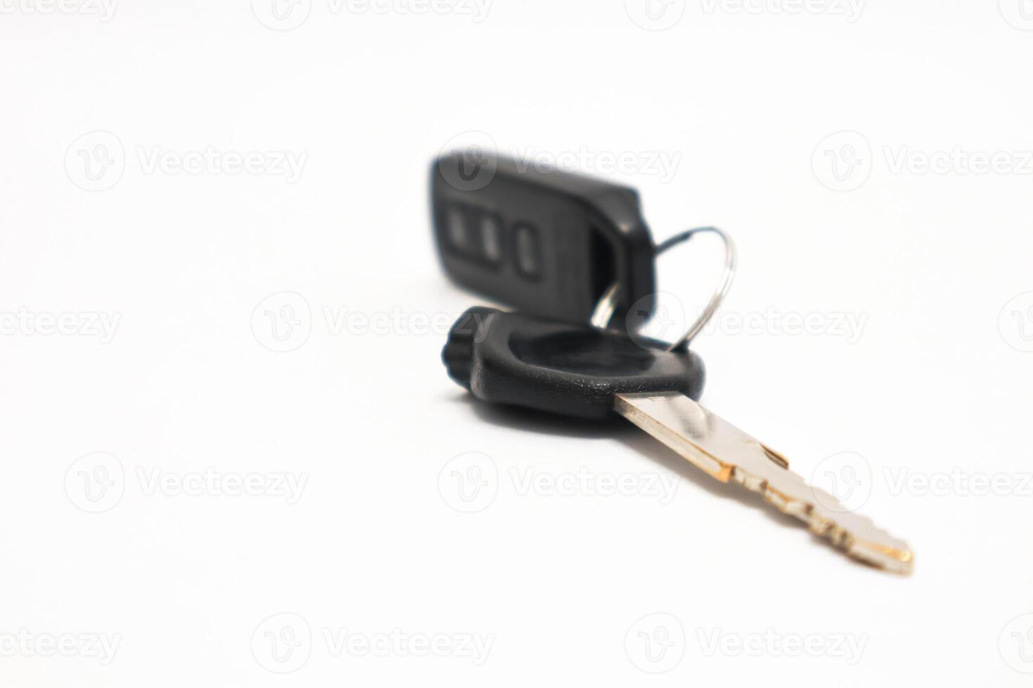 Isolated car key with remote control, representing safety and security, access to vehicle photo