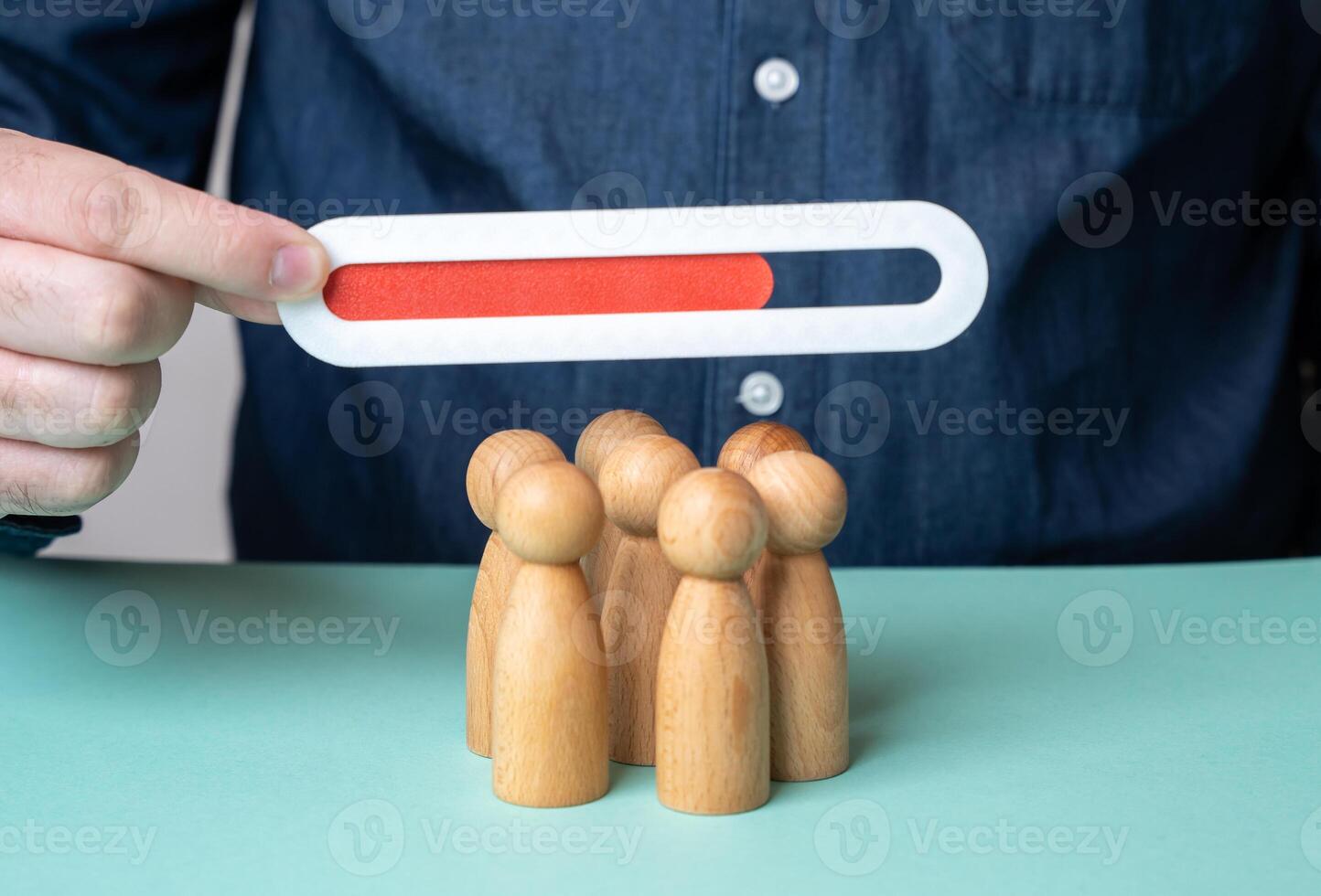 Progress bar over a crowd of people. Team efficiency indicator. Team member occupancy. Progress of work completion. Goal achievement. Workplace control. Efficiency analysis. Business processes. photo