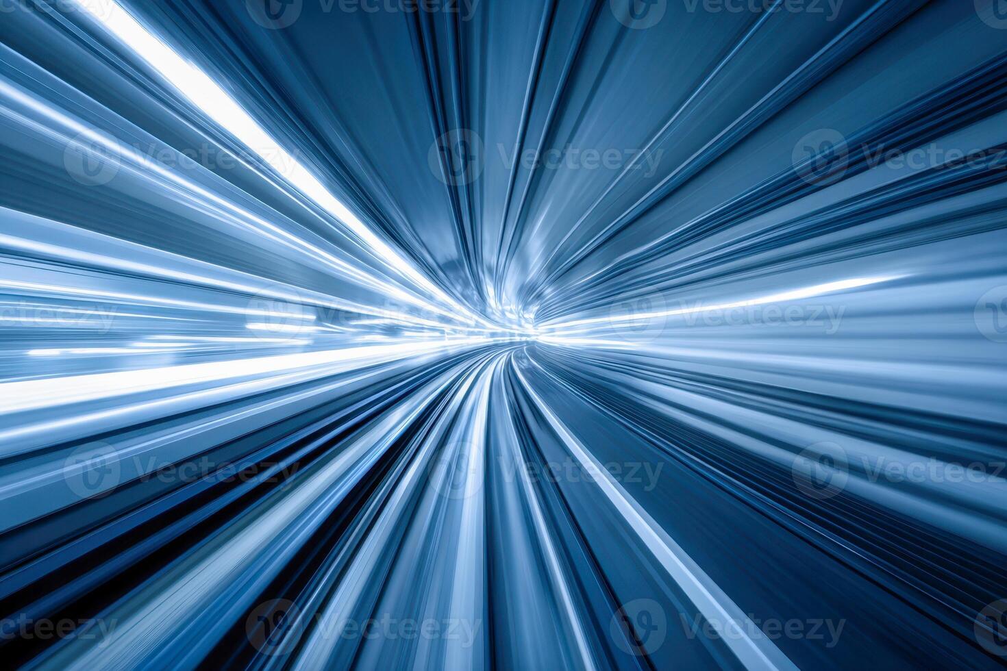 Dynamic blue light trails creating a futuristic tunnel effect symbolizing fast motion and high-speed travel on a curved pathway in a modern transportation environment photo