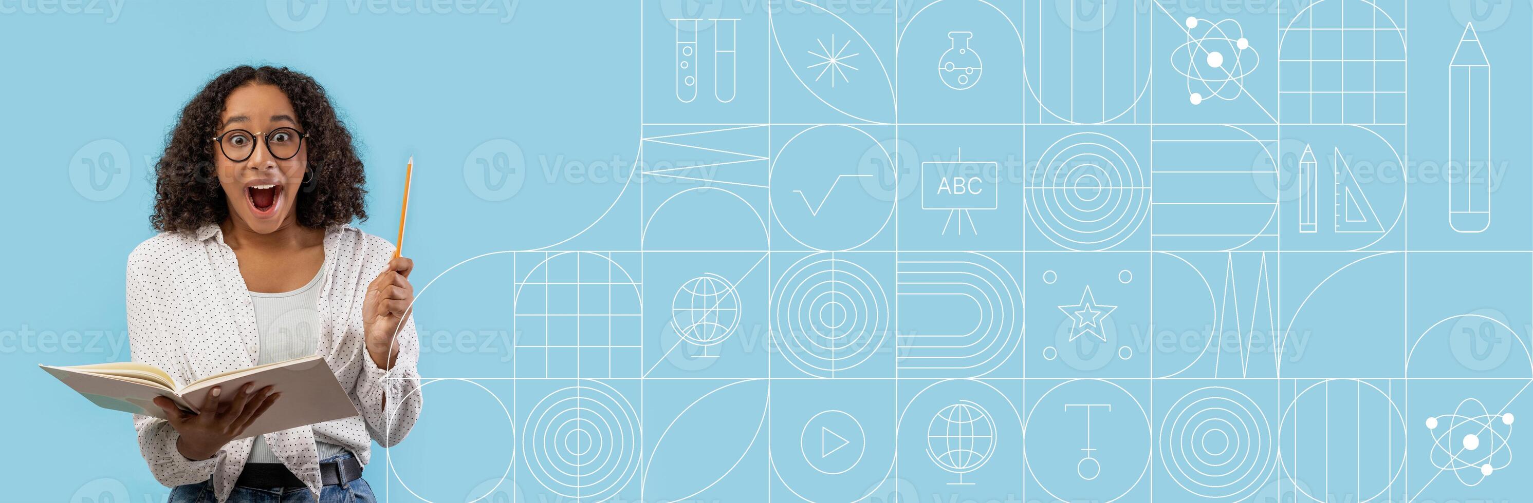 A student is excitedly studying with a notebook and pencil. They appear enthusiastic about their learning. Creative educational graphics fill the background, enhancing the learning environment. photo