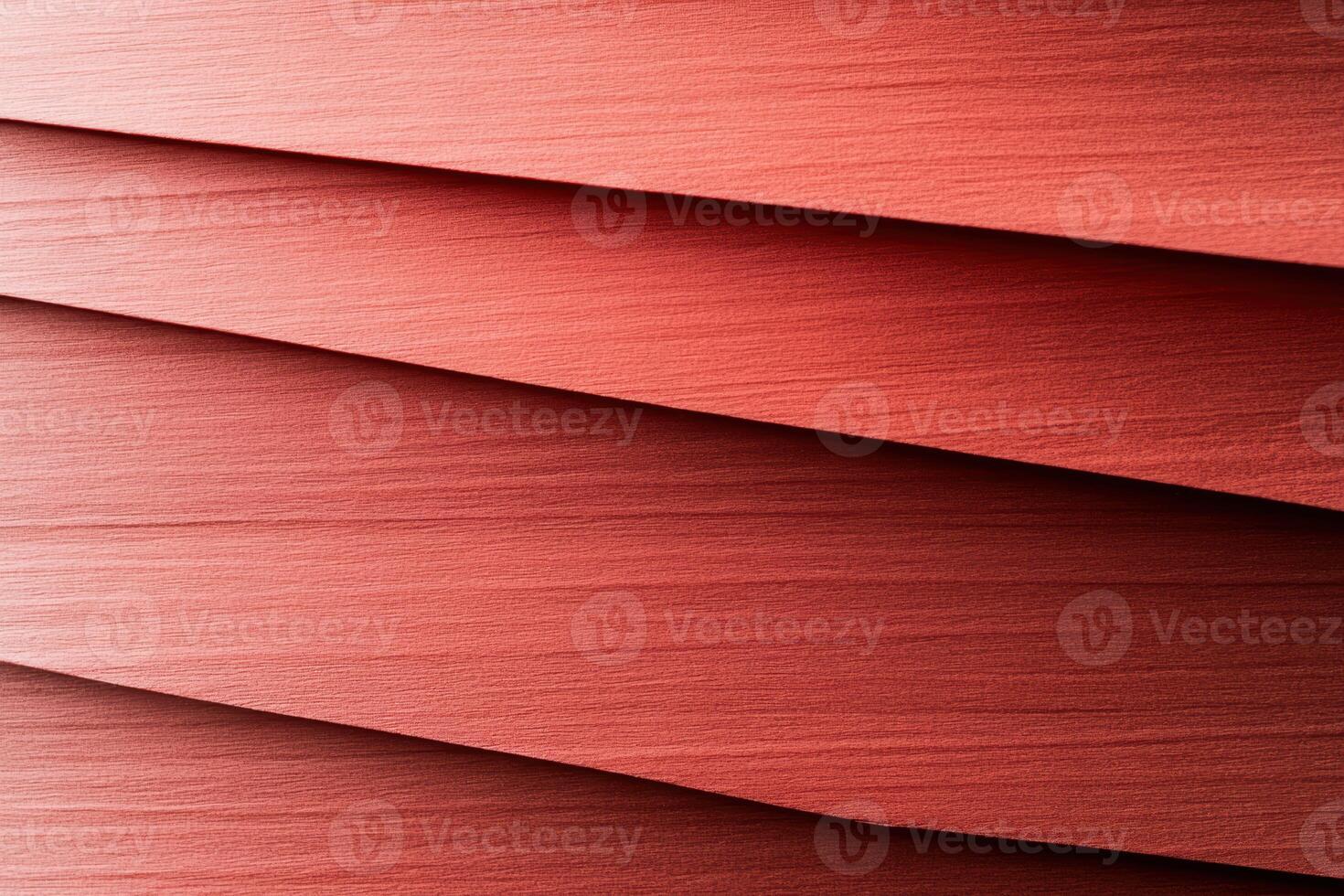 Textured red paper layers create an interesting abstract design for craft projects photo