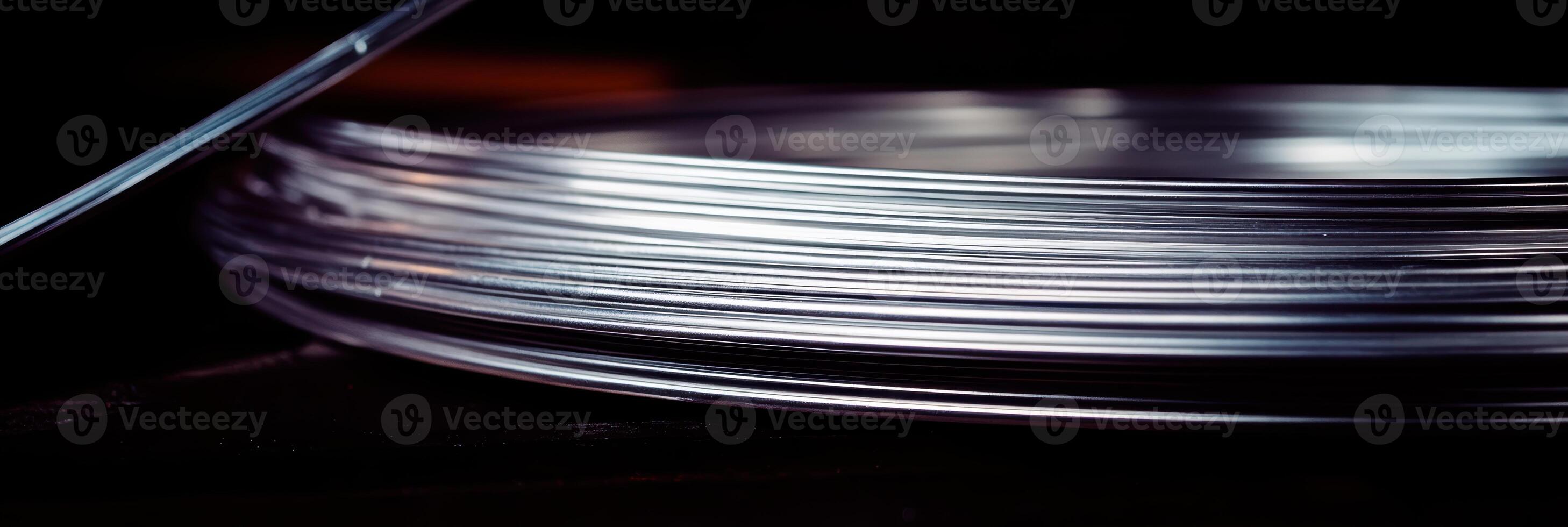 Thin transparent sheets arranged neatly on a dark surface in a creative workspace photo