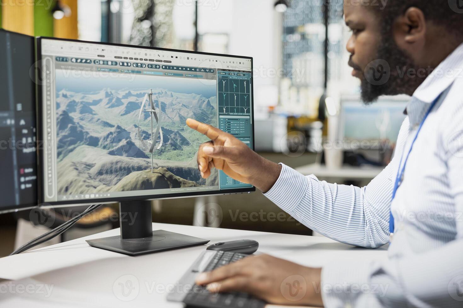 Close up of engineer analyzing advanced wind turbine models to improve efficiency and environmental performance. Designer creates innovative VAWT turbine in CAD software with higher clean energy yield photo