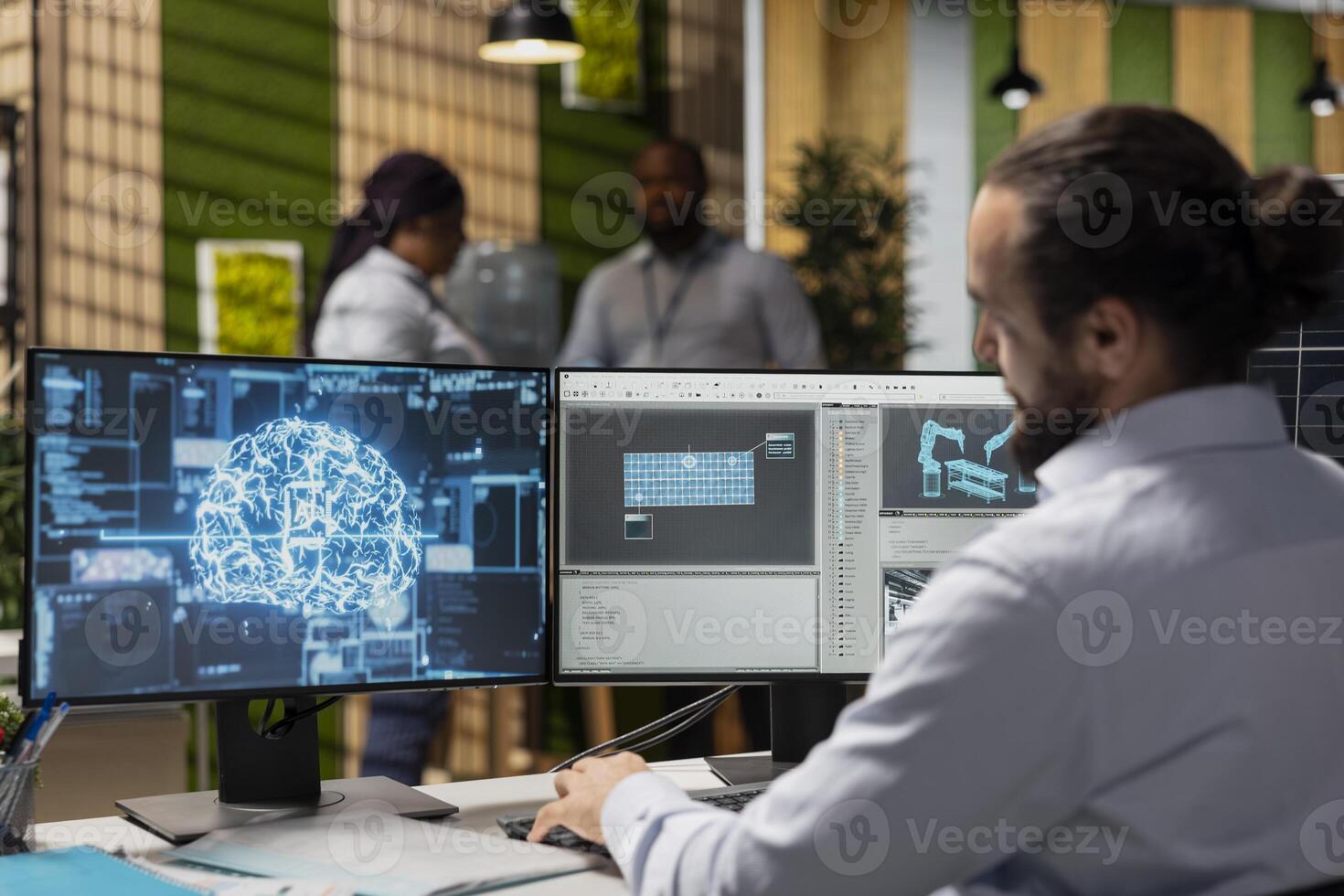 Software developer in office using AI LLM assistant to design solar panel cells. Worker uses neural network machine learning to develop robotic arm systems for solar panel production photo
