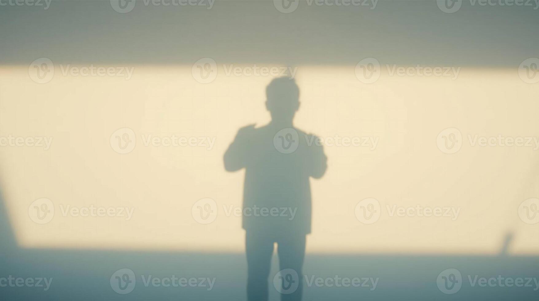 Confident businessman gesturing dynamically, projecting ideas in a bright, modern space with dramatic shadow play.AI Generate photo