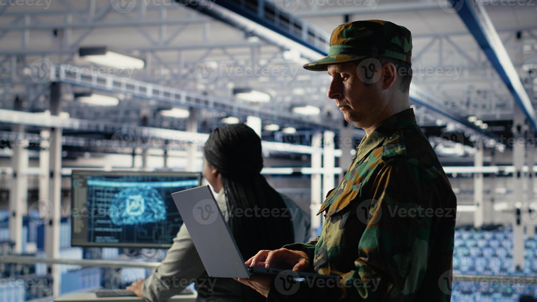 Military soldier and engineer in server room use AI tools to manage computer systems. Army commander and female programmer review information using artificial intelligence in server farm, camera B photo
