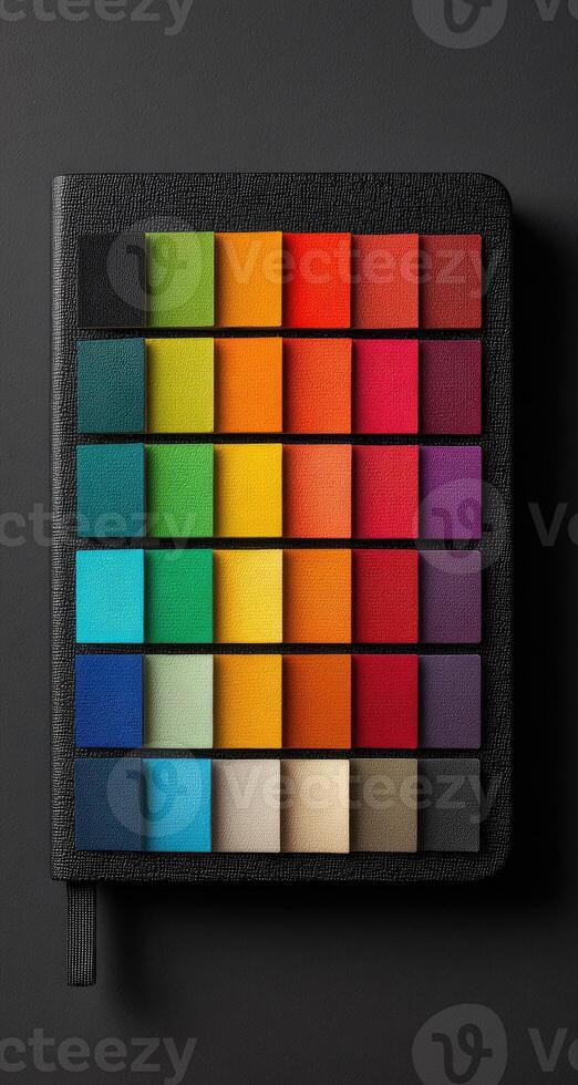 A colorful notebook with squares of different colors photo