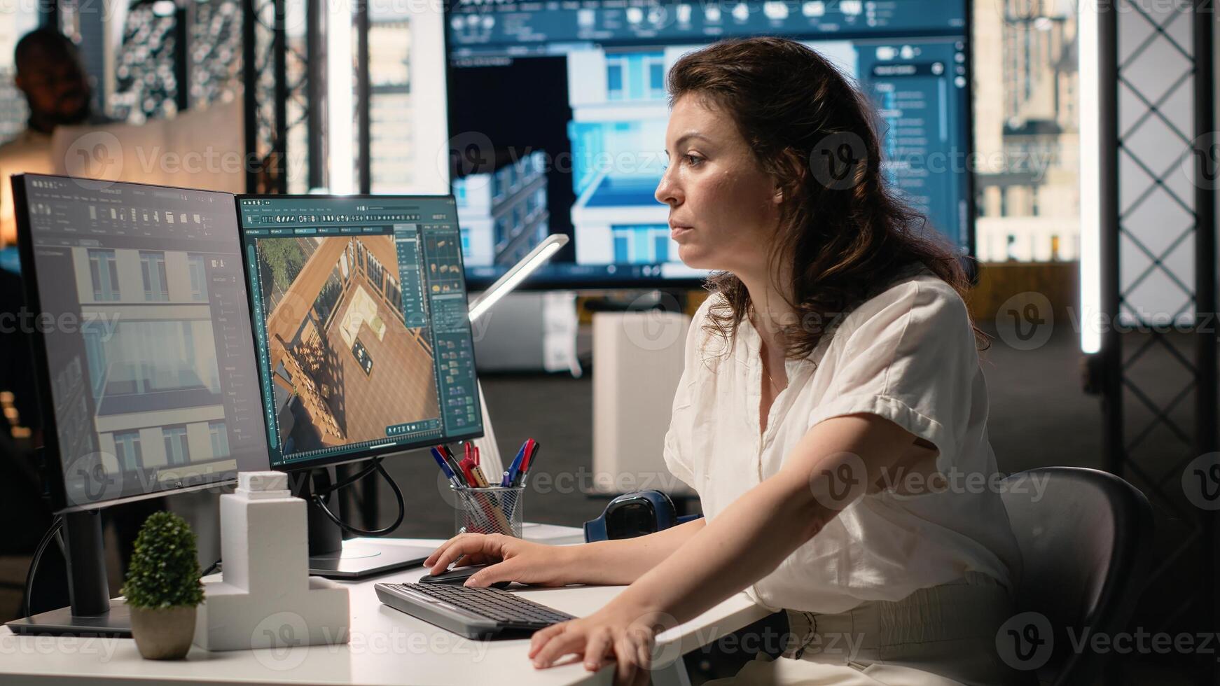 Property developer analyzing real estate blueprints and infrastructure design with software tools, planning residential expansion and layout with walls structure for new construction. photo