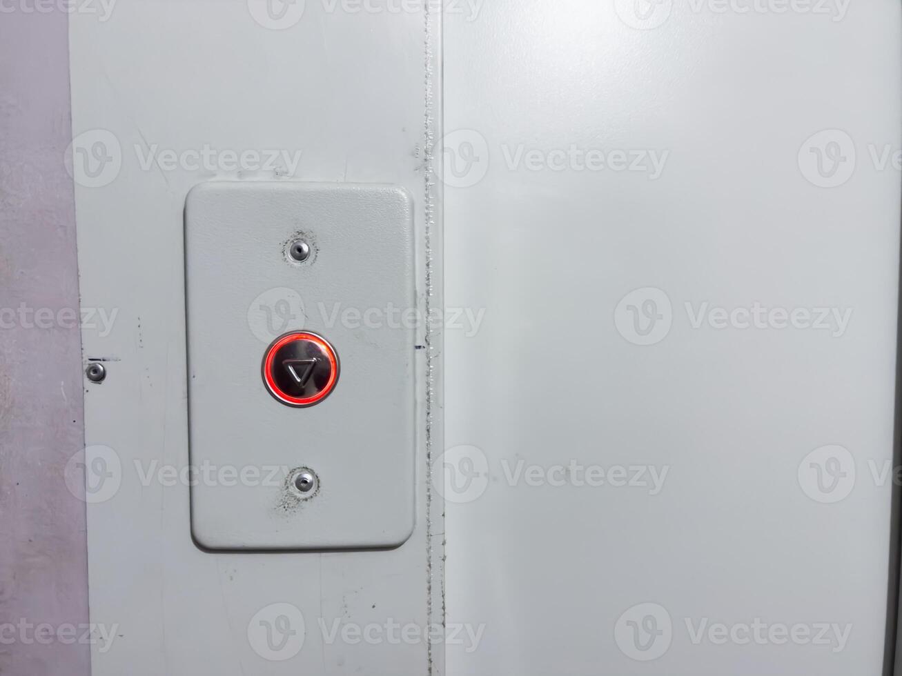 Elevator call button, new button in old house, silver button with red backlight photo
