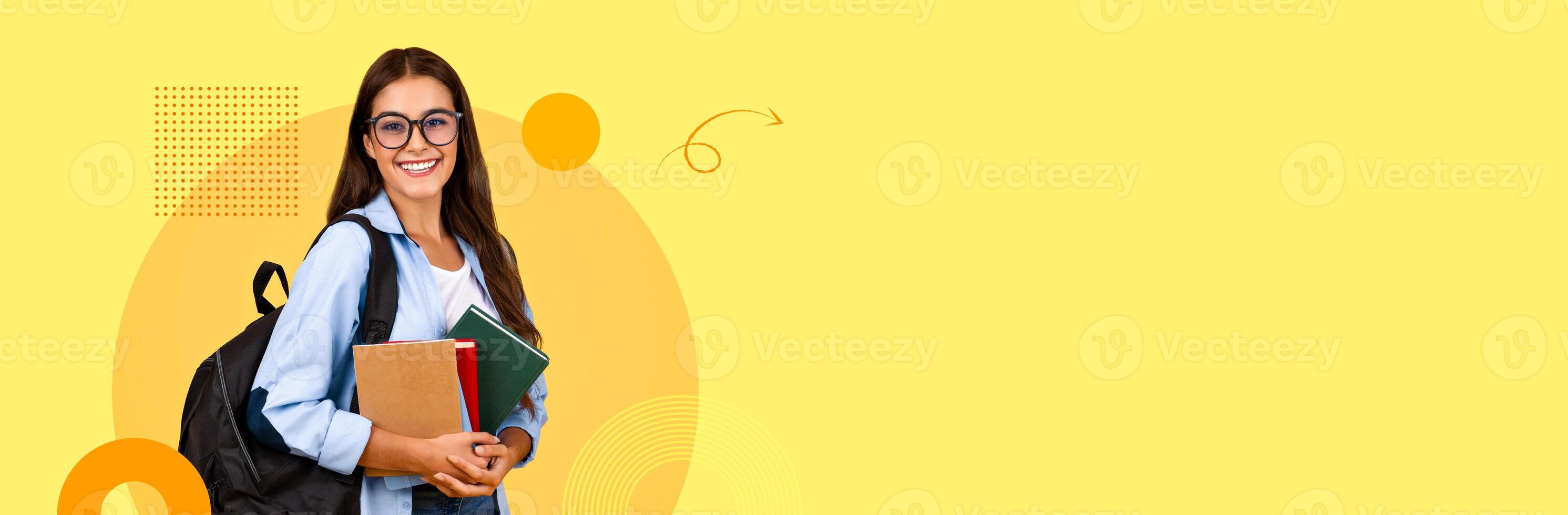 A student in a casual outfit stands confidently with a backpack, holding several books and smiling. The background features vibrant colors, creating a lively atmosphere suitable for learning. photo