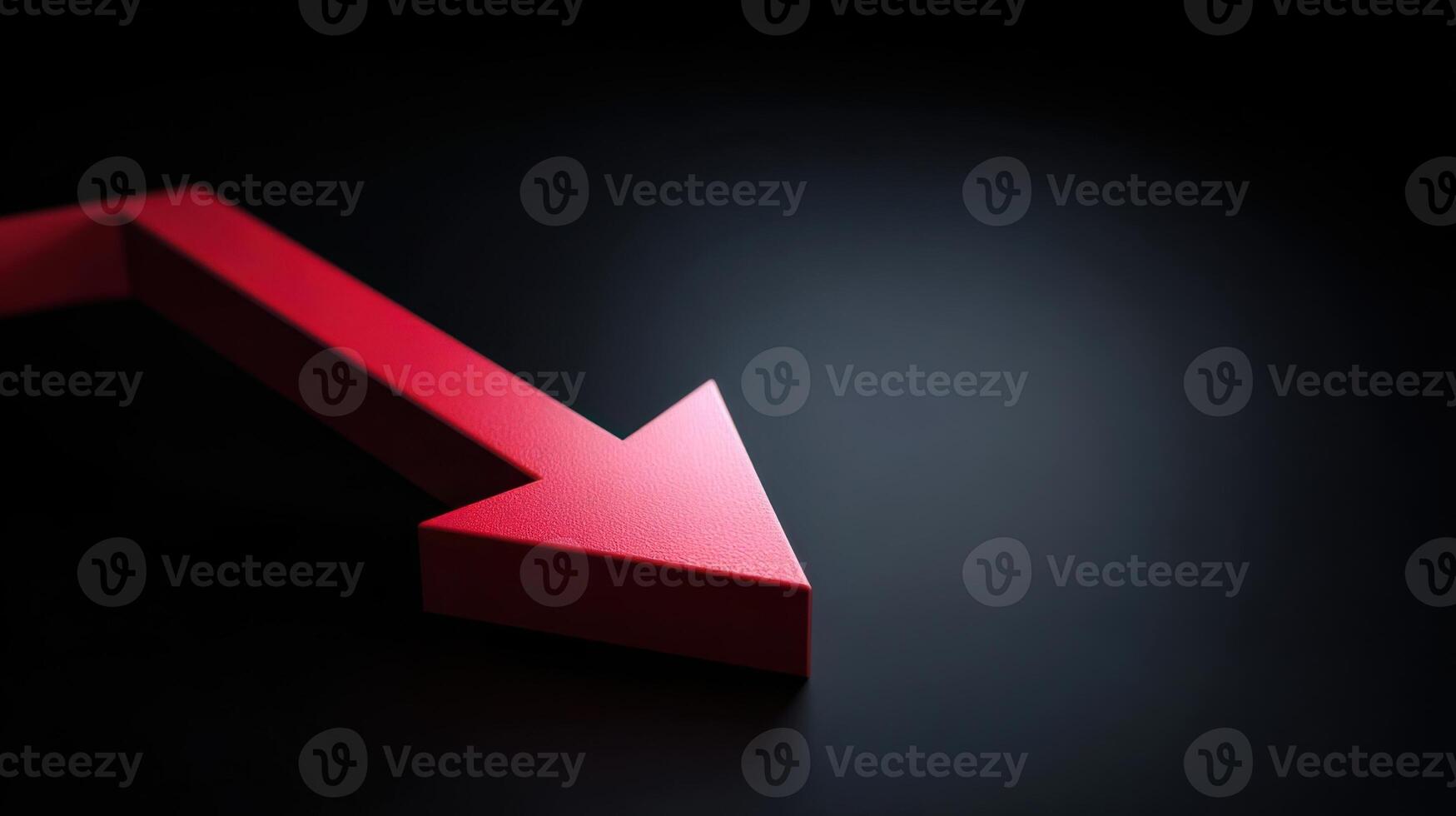 Red arrow pointing downward on dark background photo