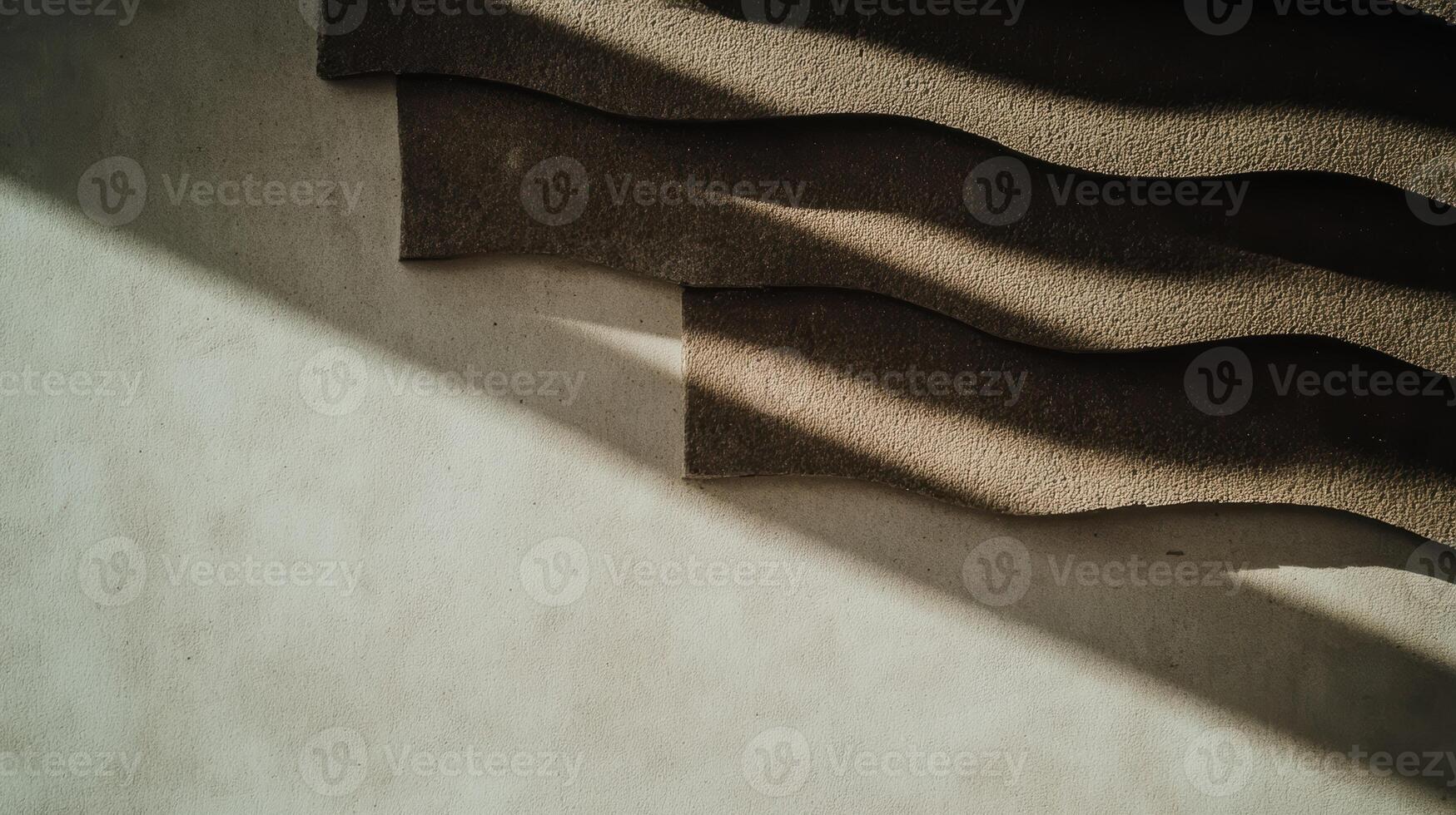 Soft shadows create patterns on the textured wall in natural light photo