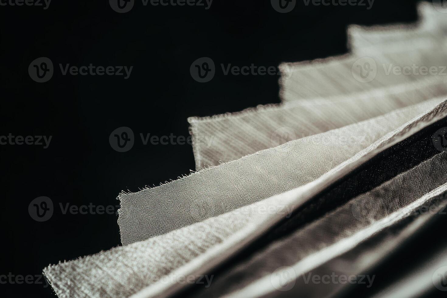 Different fabrics arranged in layers showcasing texture and color variations photo