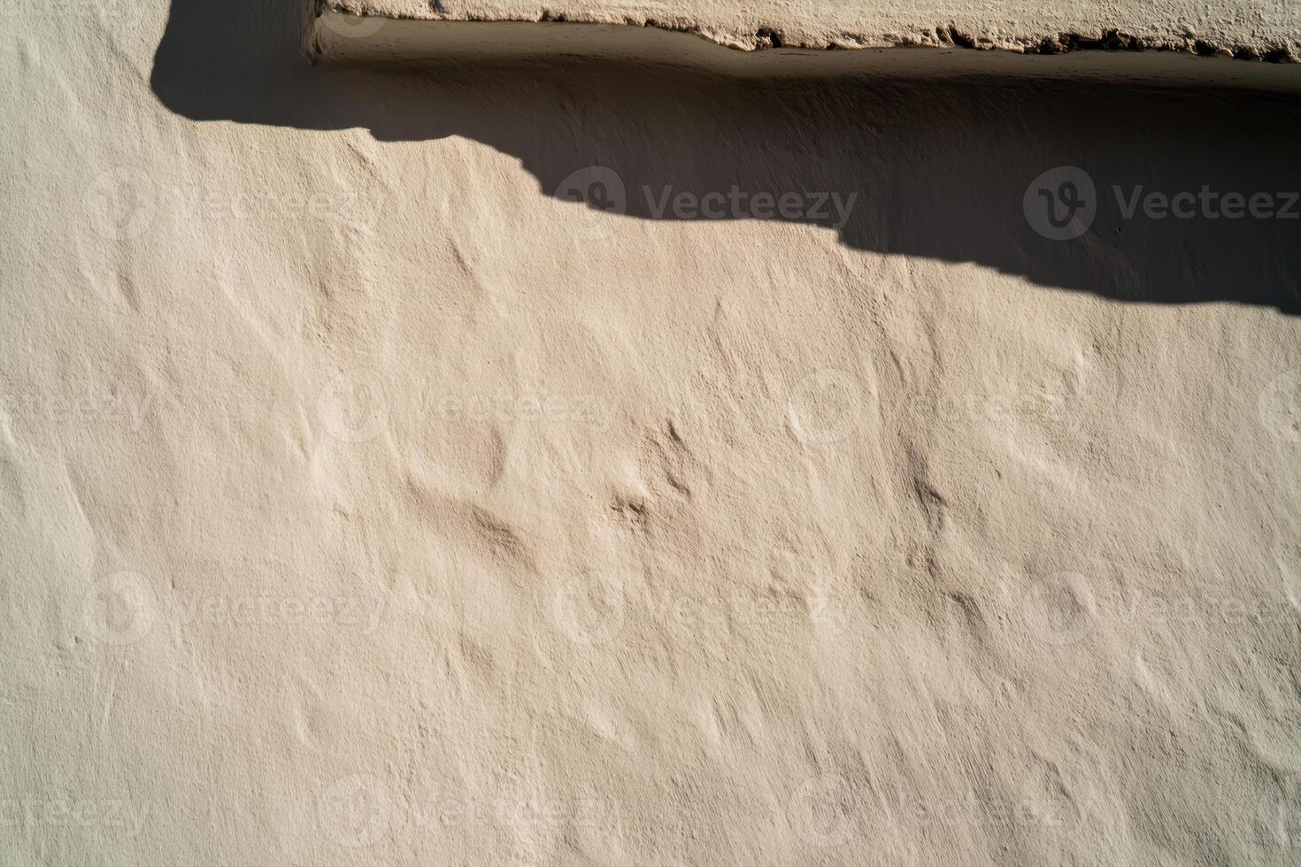 Textured wall with shadow creates an interesting visual effect in sunlight photo