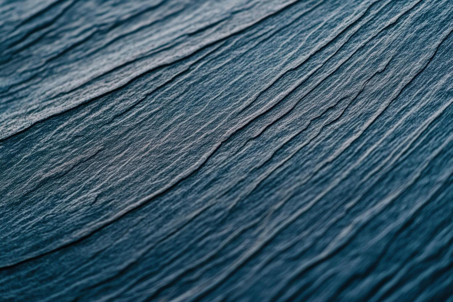 Abstract texture of dark blue slate with intricate patterns and lines photo